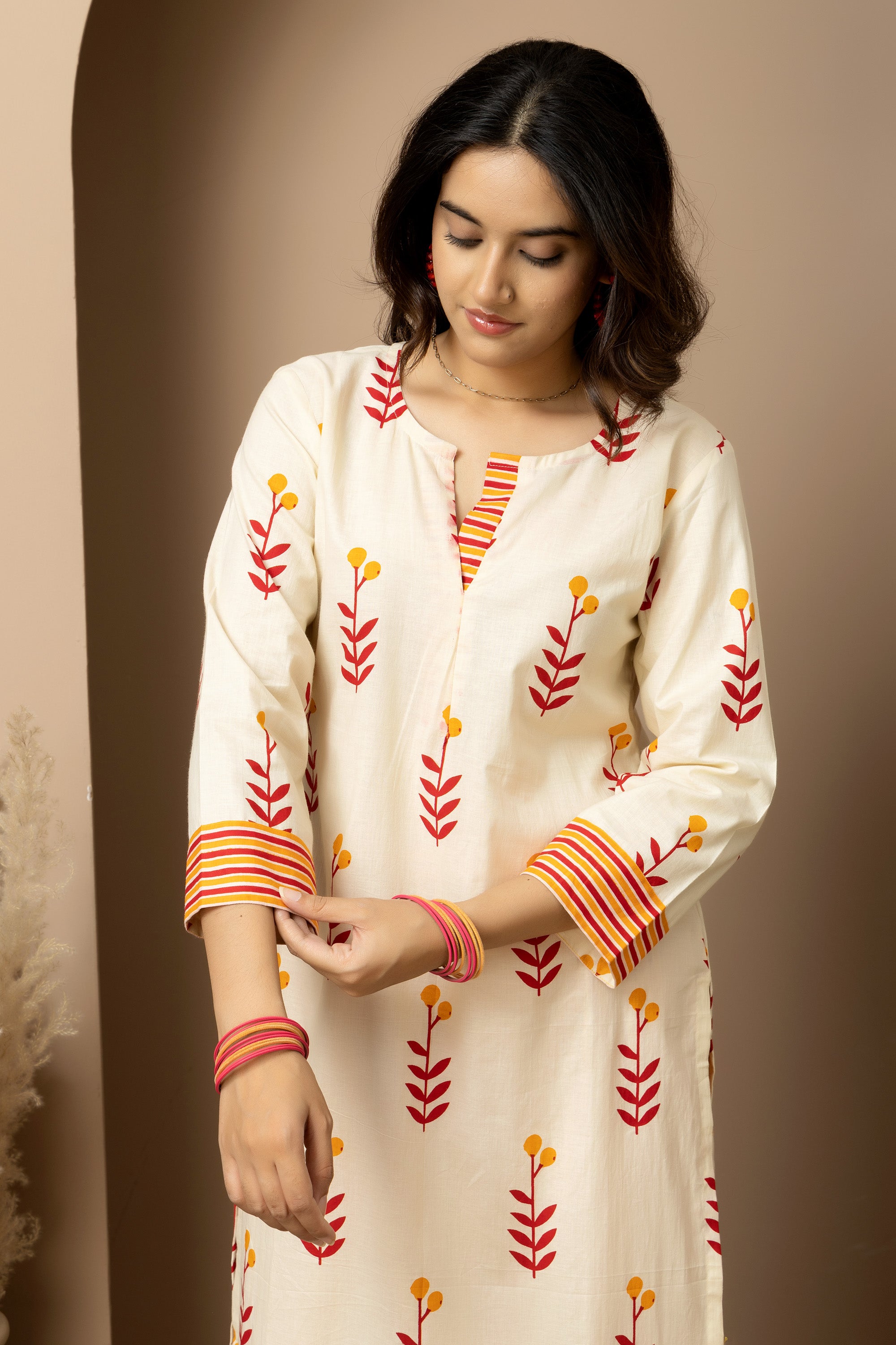 Kesar Bloom - Cotton kurta with pants in cream colour with orange-red floral screen print