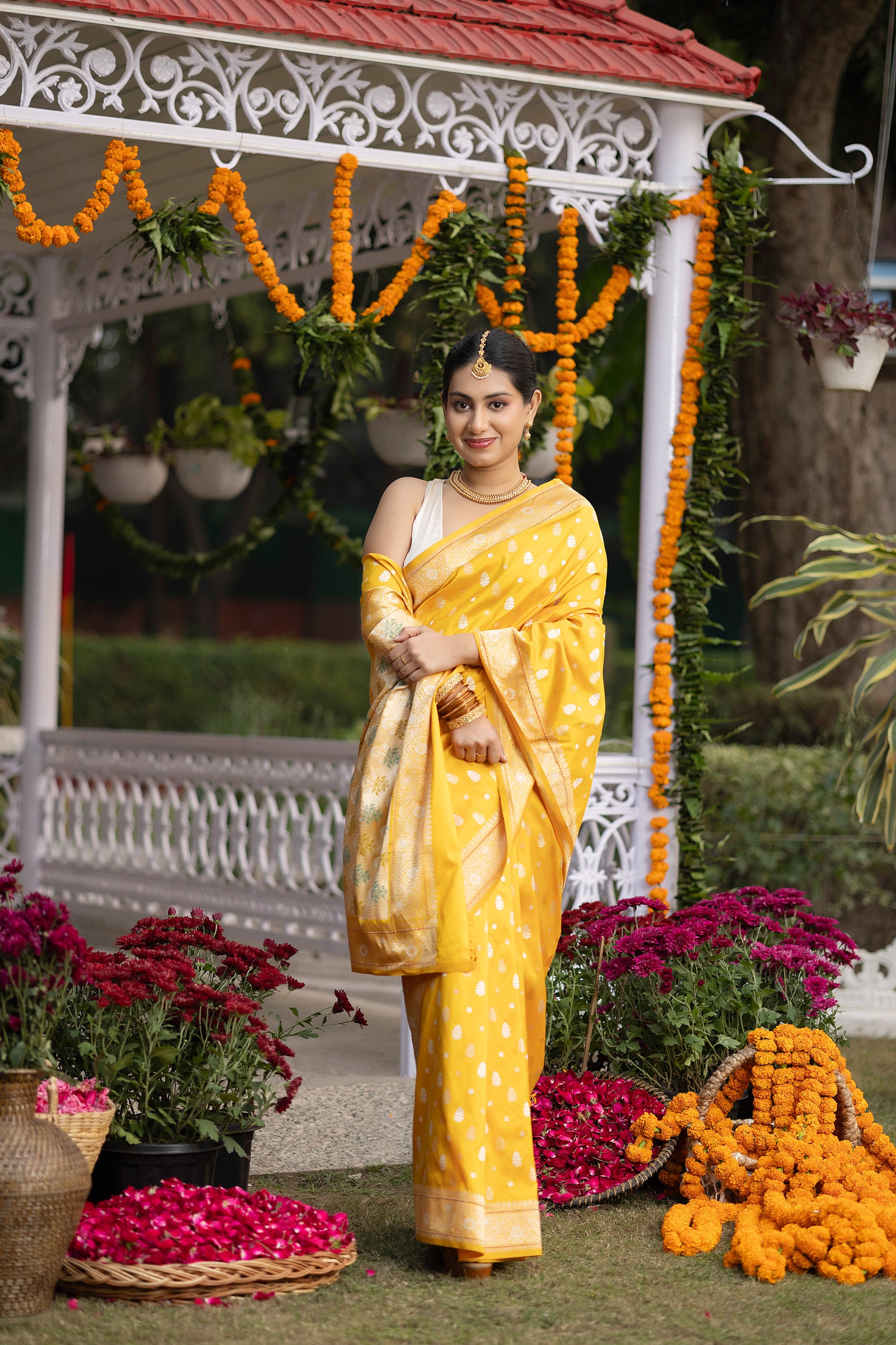 Banarasi pure silk yellow handloom saree with intricate zari Buti all over and intricate border with minakari work on the pallu