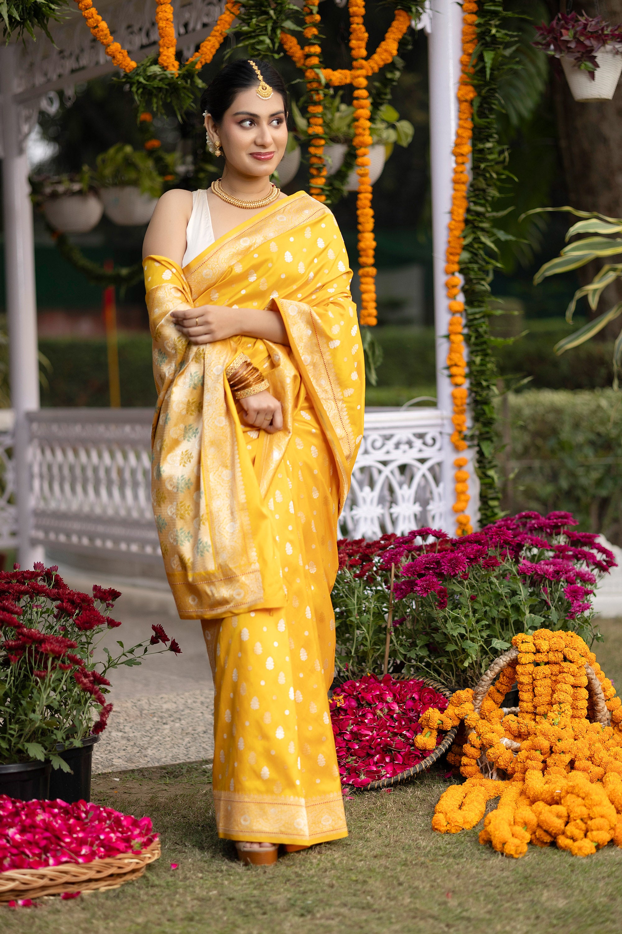 Banarasi pure silk yellow handloom saree with intricate zari Buti all over and intricate border with minakari work on the pallu