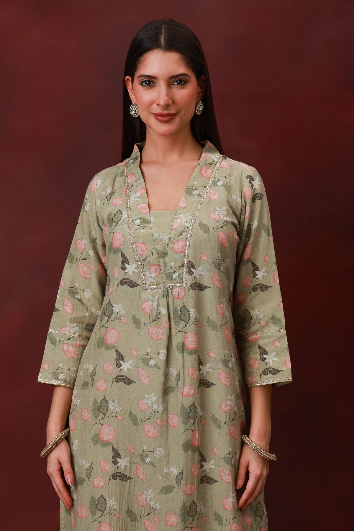 Model wearing the Gulnoor sage green floral Chanderi silk three-piece suit with dupatta