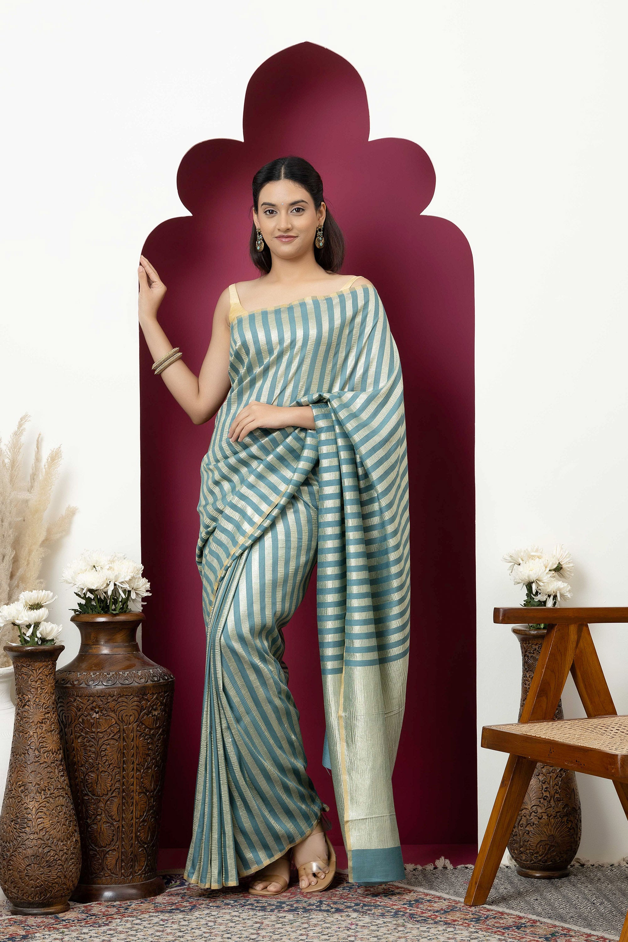 Beautiful Banarasi green pure Muga silk saree with alternate stripes of crinkled tissue and zari pallu