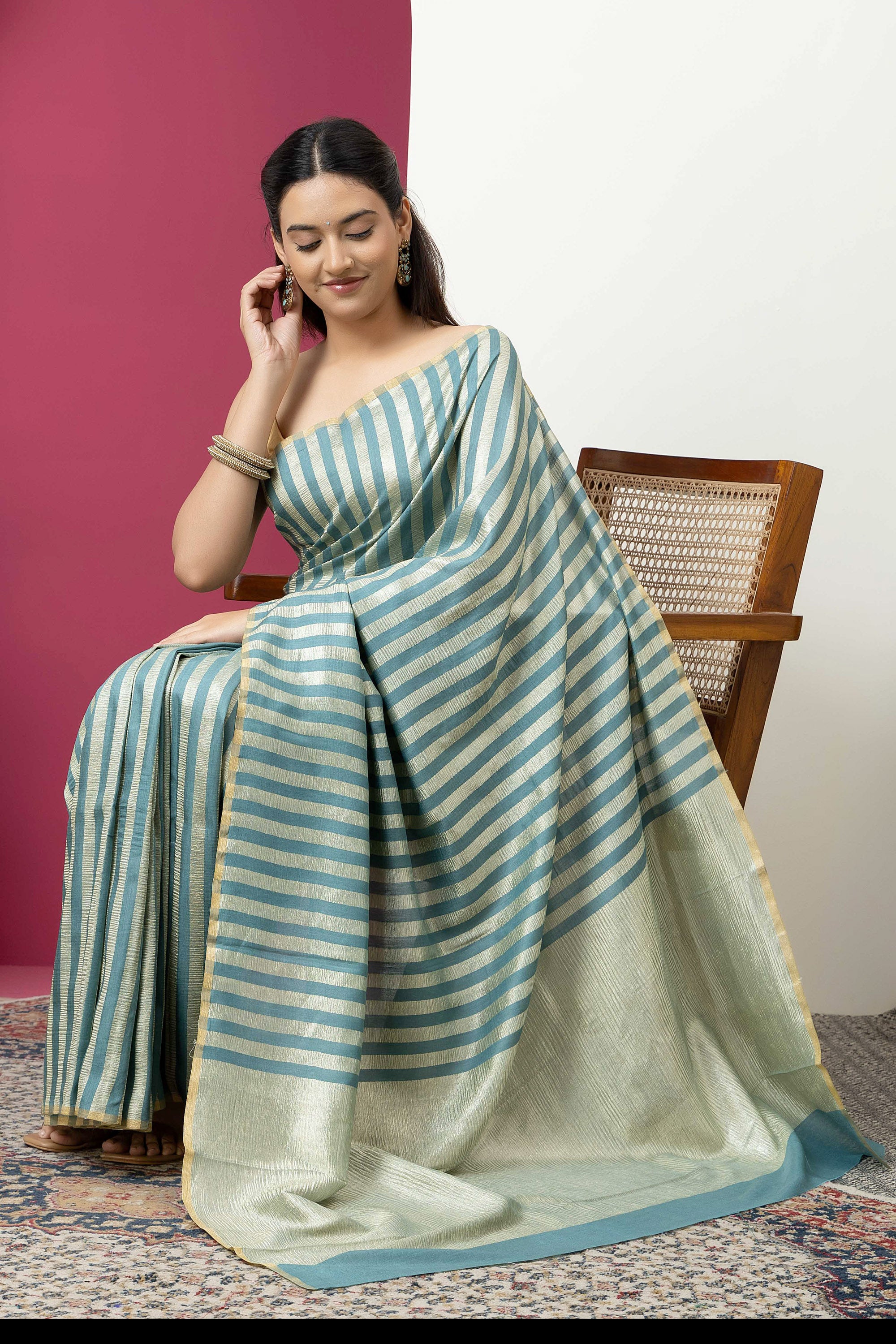 Beautiful Banarasi green pure Muga silk saree with alternate stripes of crinkled tissue and zari pallu