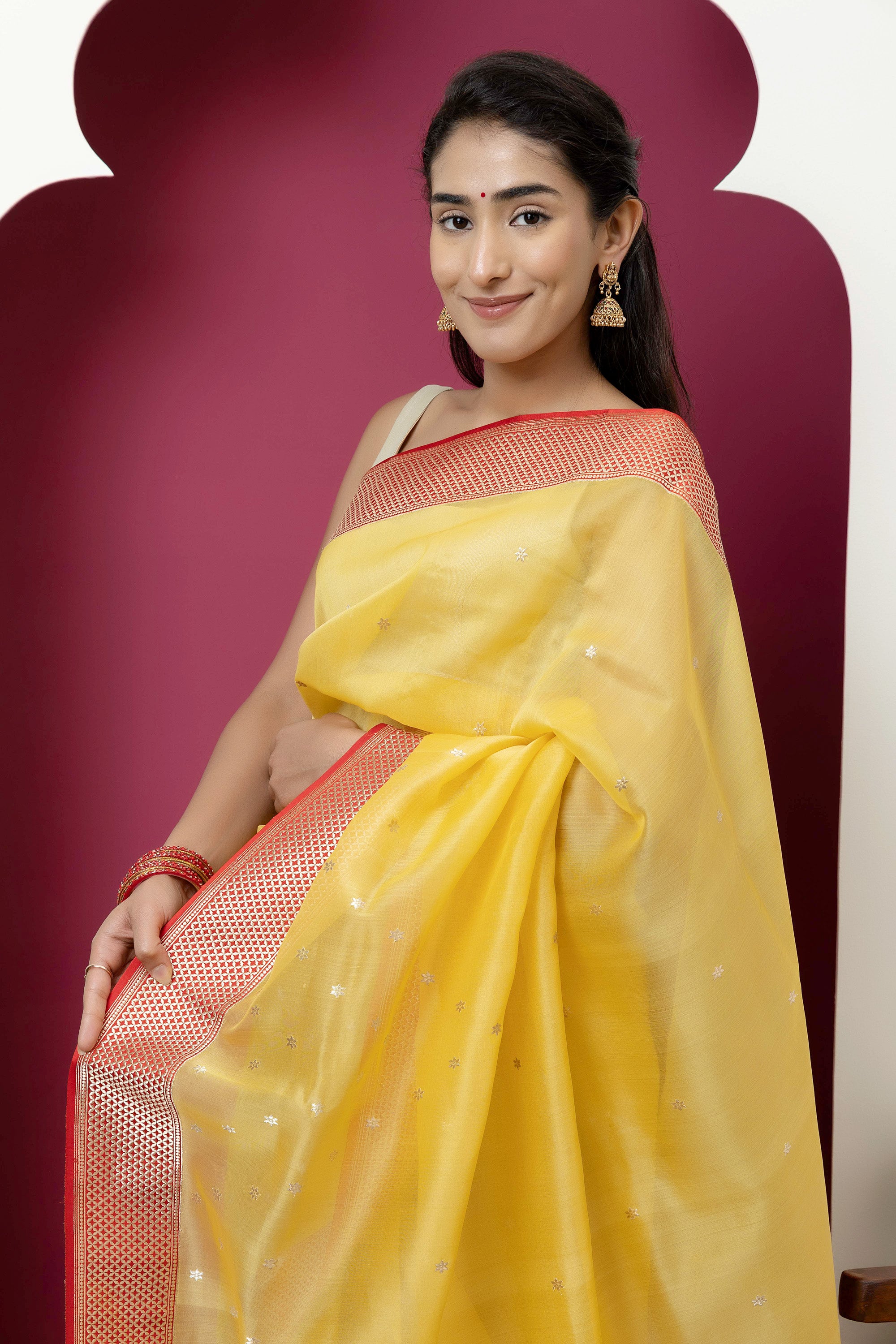 Banarasi handloom pure organza silk saree in summerish yellow shade with zari border and pallu on a red/crimson contrast silk