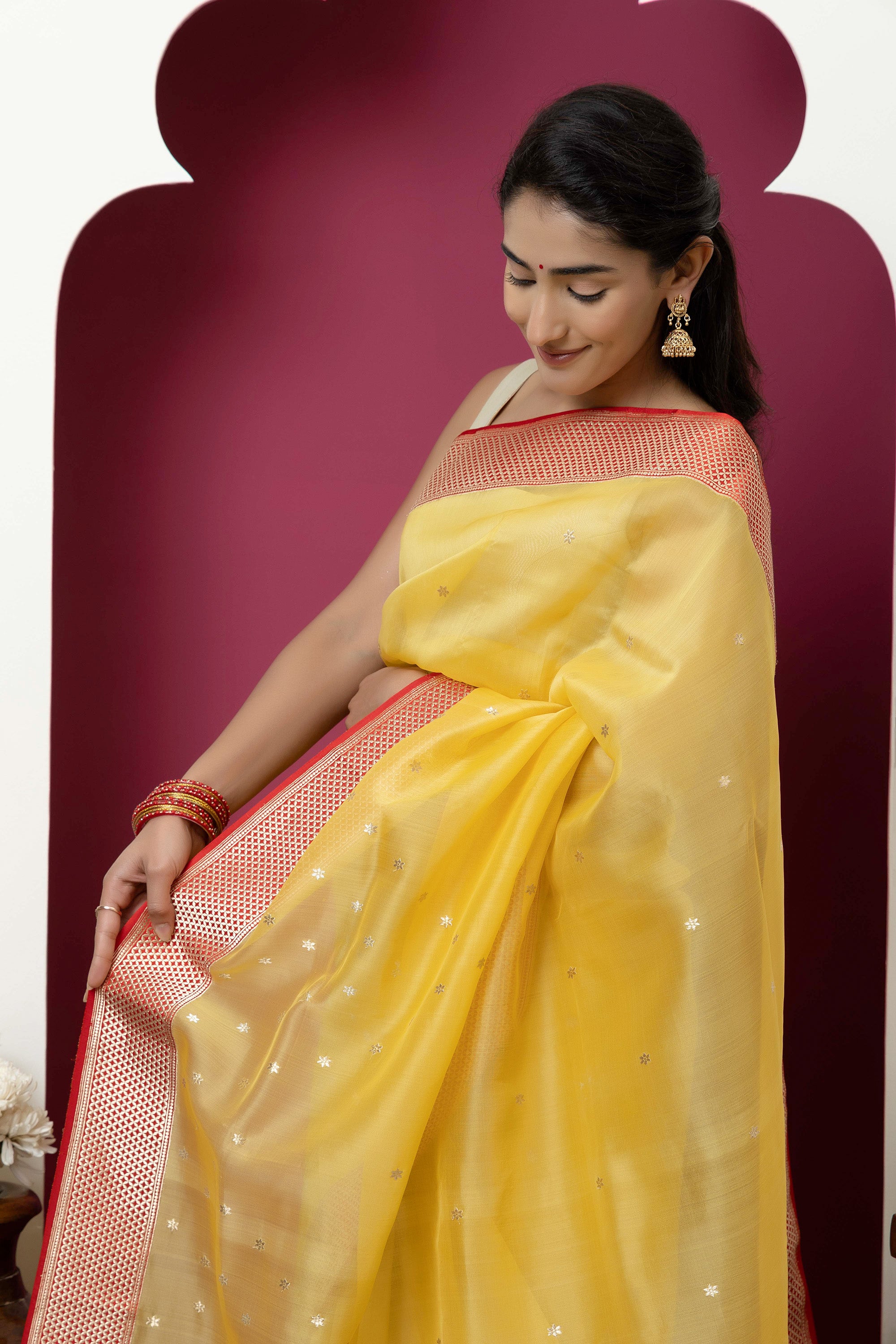 Banarasi handloom pure organza silk saree in summerish yellow shade with zari border and pallu on a red/crimson contrast silk