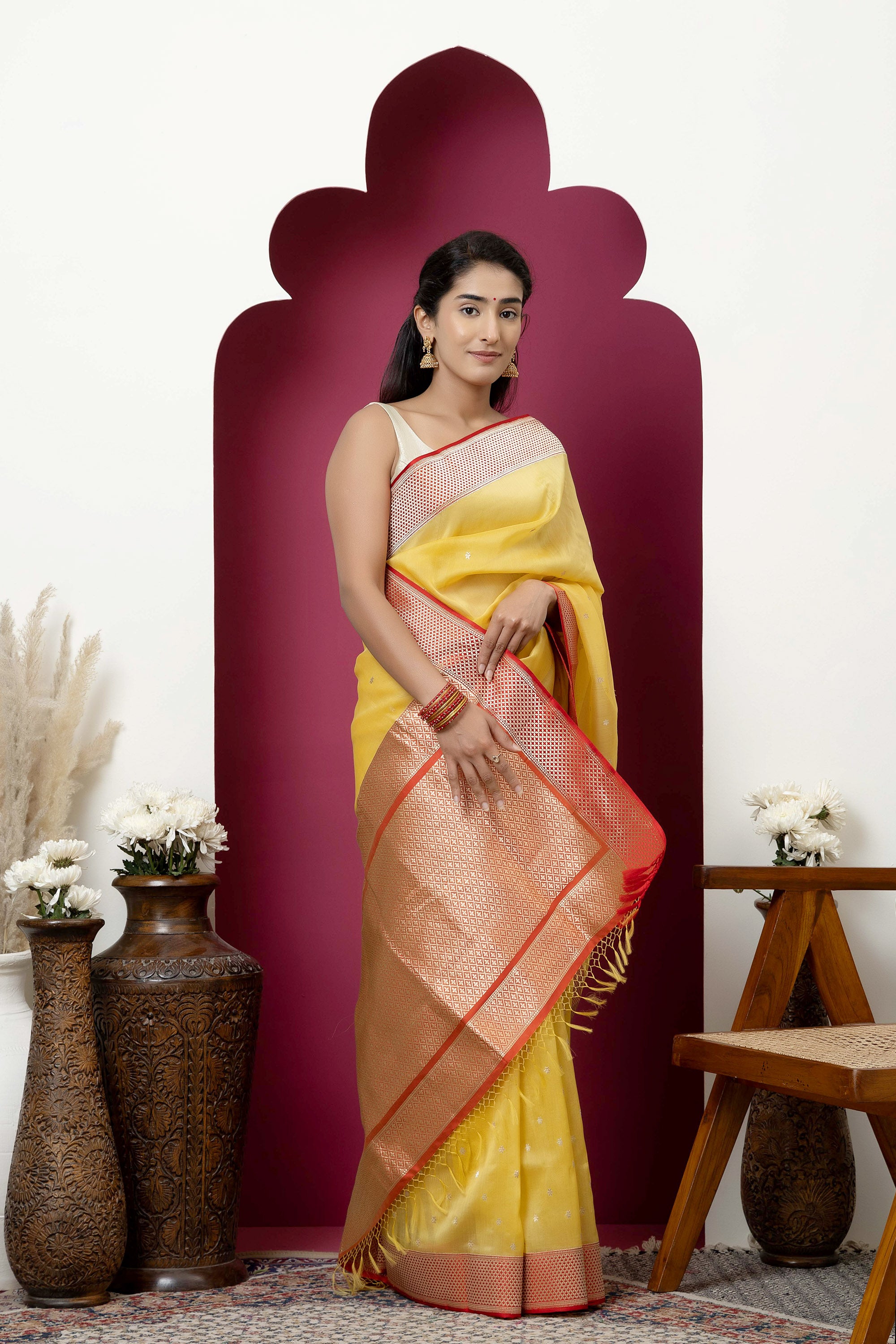 Banarasi handloom pure organza silk saree in summerish yellow shade with zari border and pallu on a red/crimson contrast silk