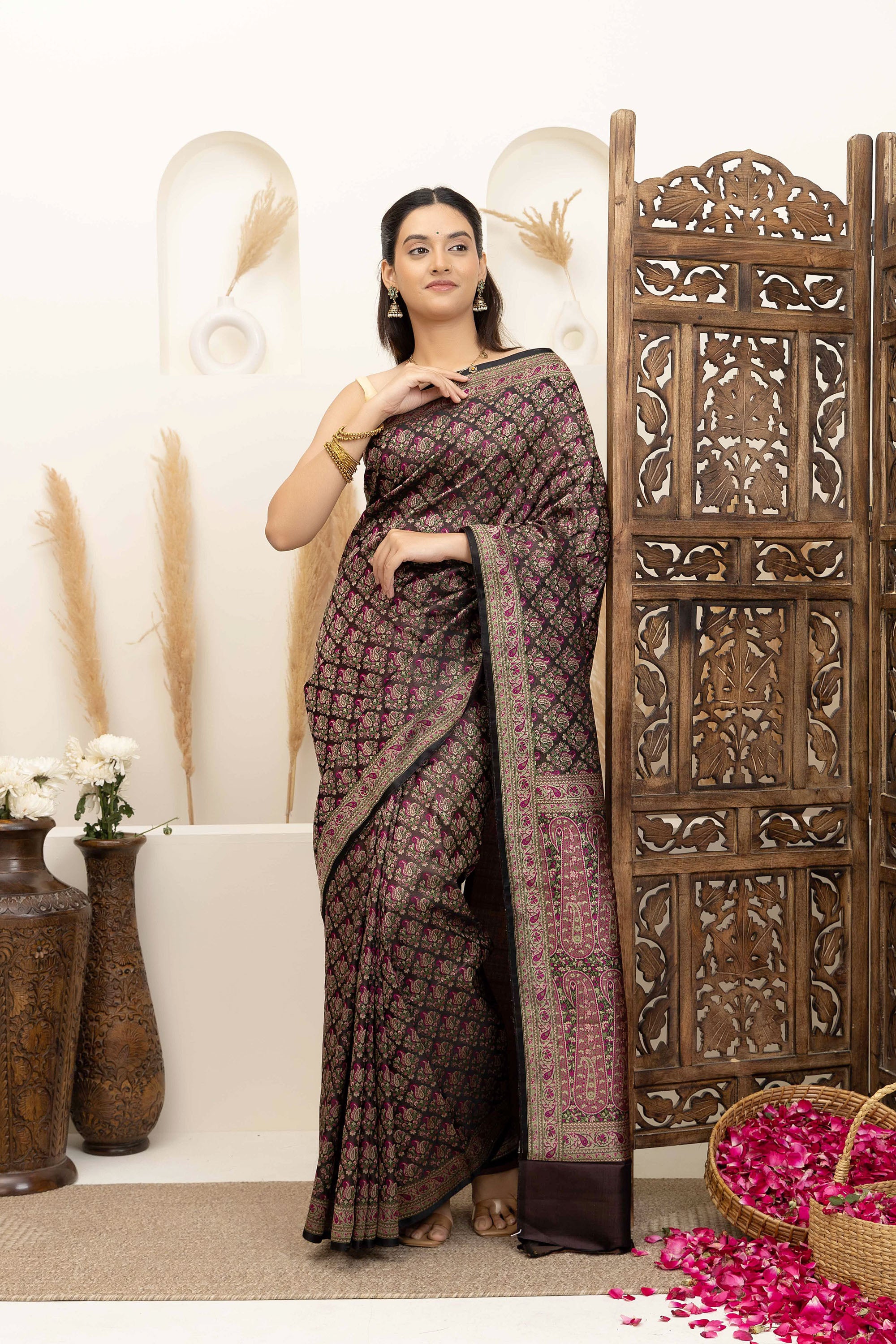 Banarasi pure silk tanchui saree. It’s a rich majenta on brown undertone saree with intricate resham weaving
