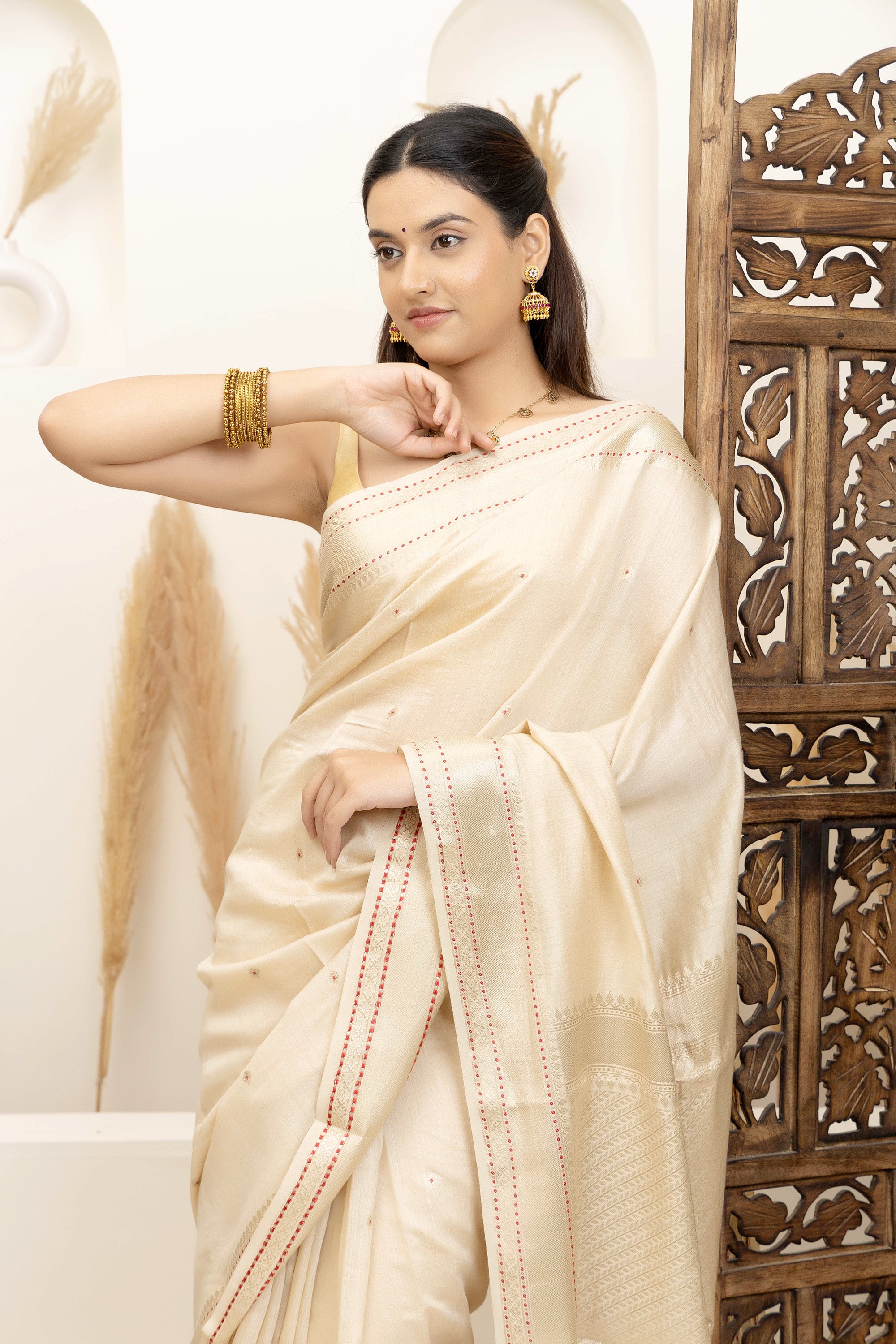Banarasi Pure muga silk saree in natural silk beige colour, with small bute, zari border and pallu