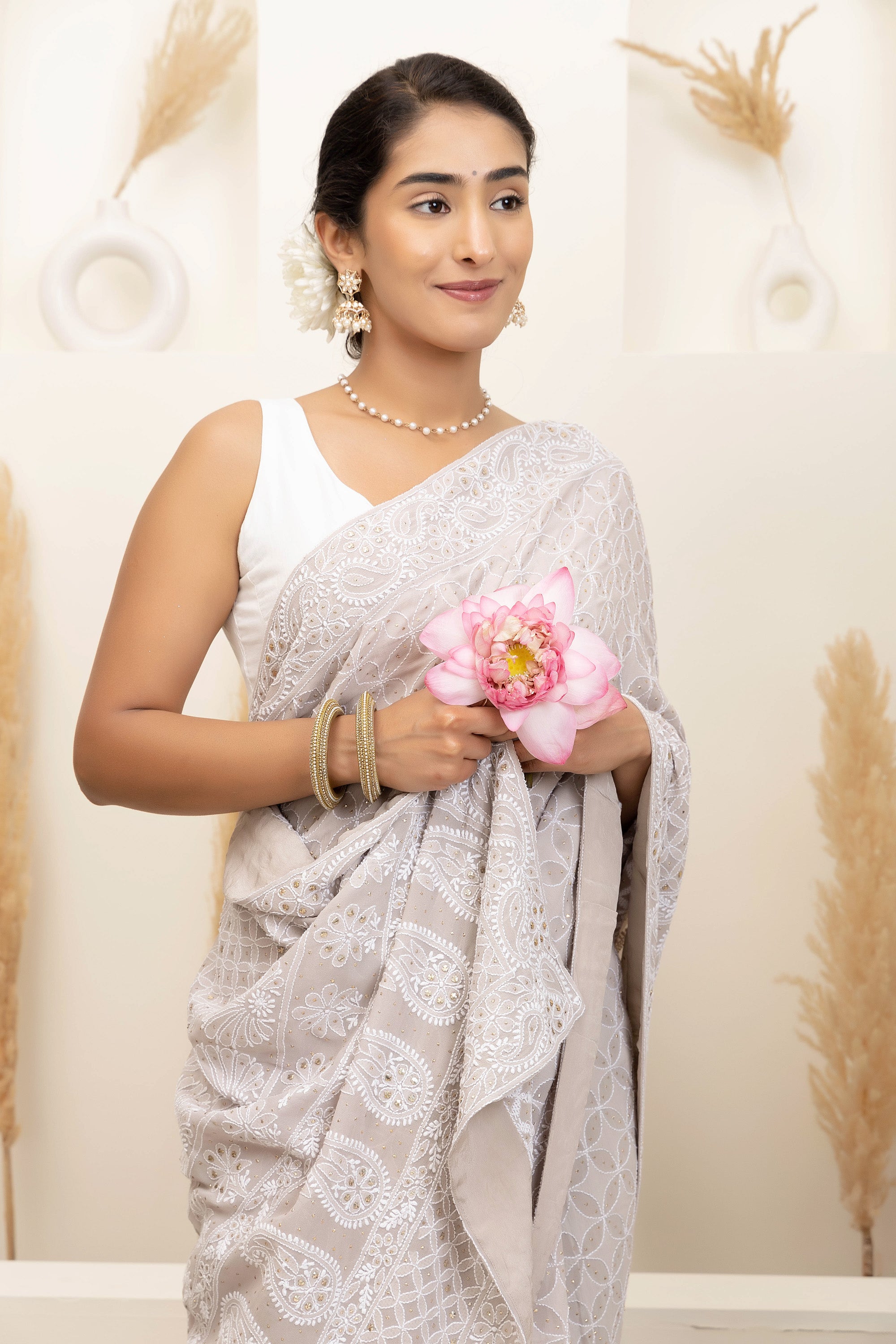 Elegant grey pure heavy georgette silk saree with fine embroidered Chikankari work all over the saree