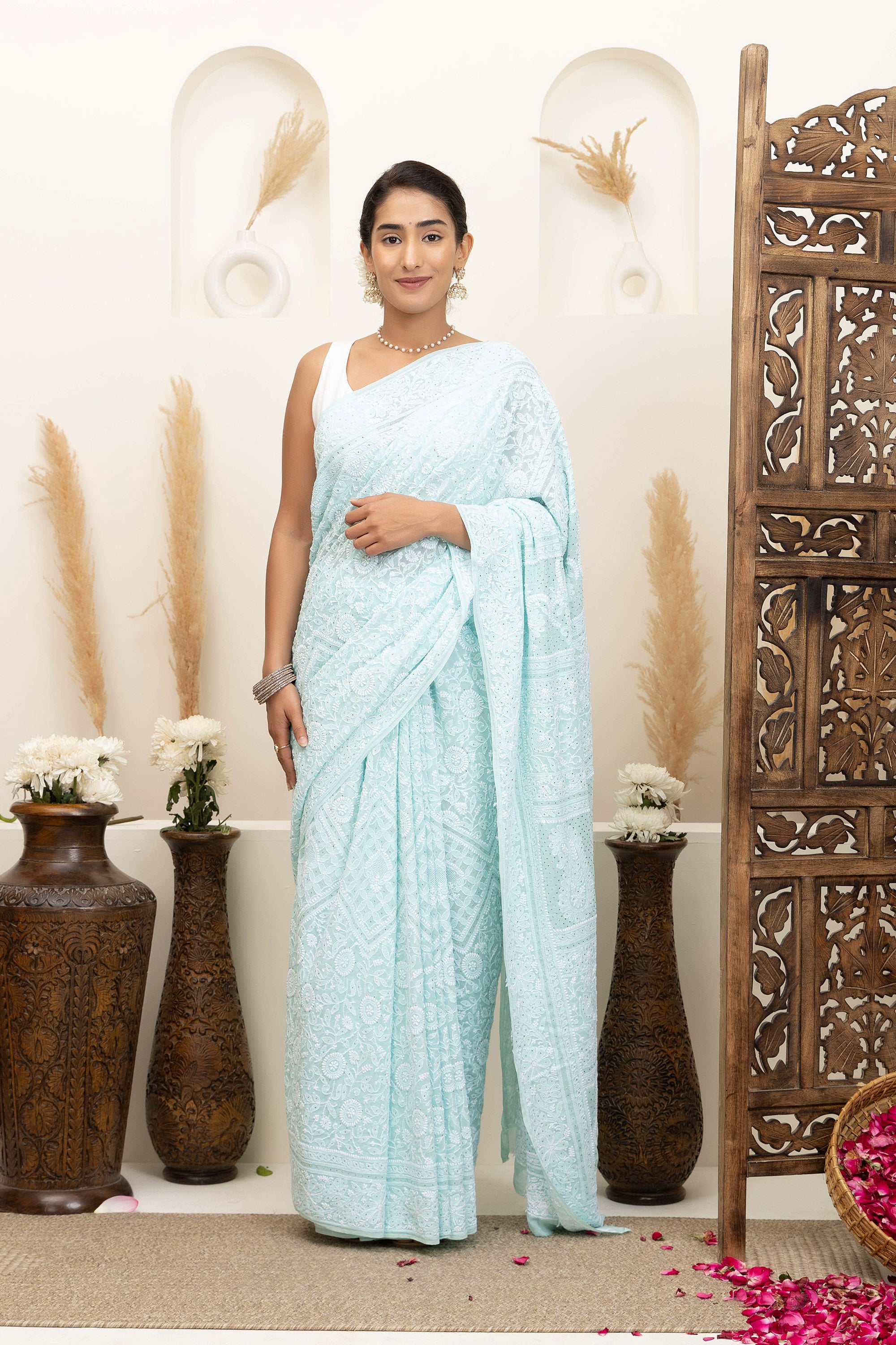 Elegant light blue pure silk georgette saree with fine embroidered Chikankari and mokaish work all over the saree
