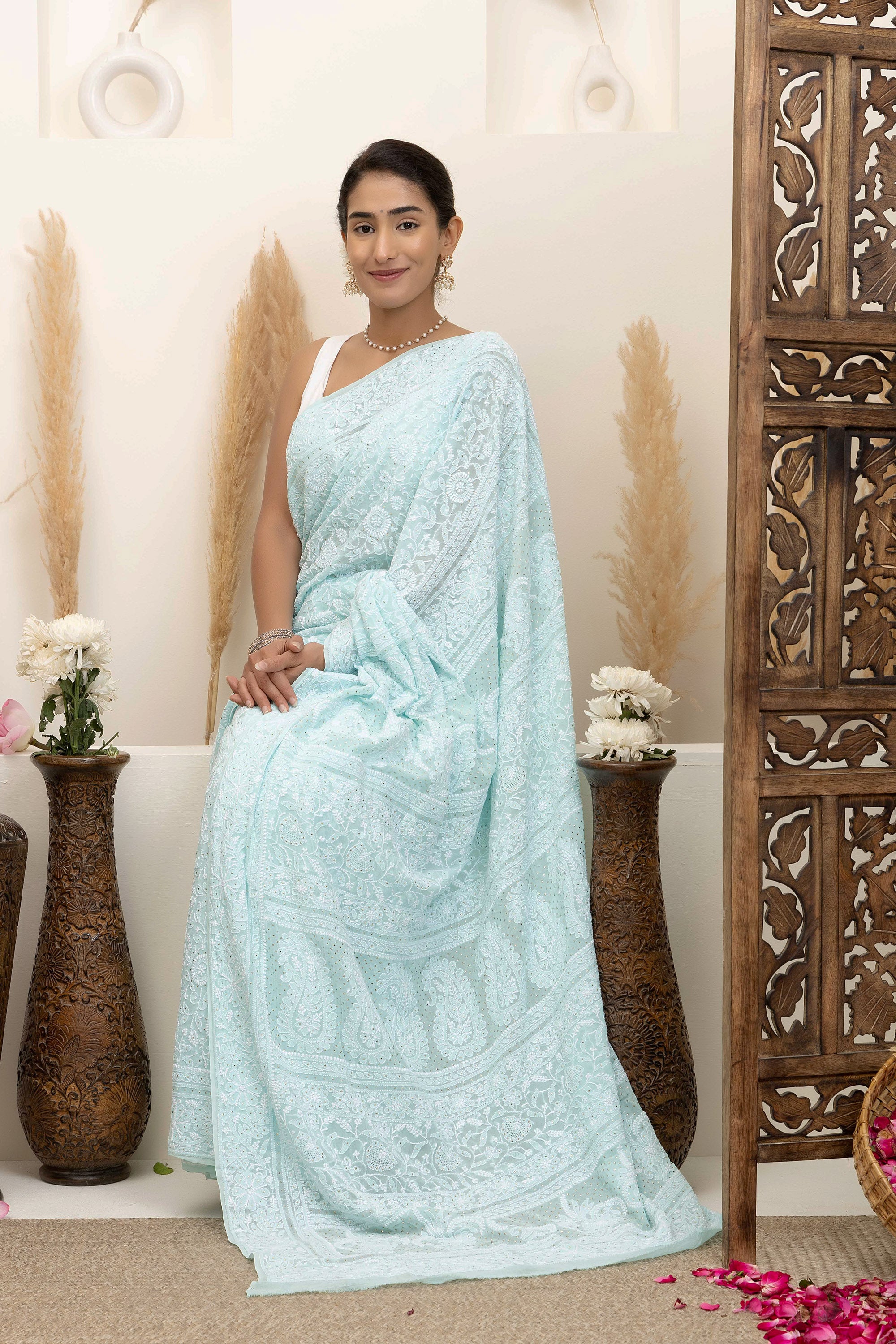 Elegant light blue pure silk georgette saree with fine embroidered Chikankari and mokaish work all over the saree