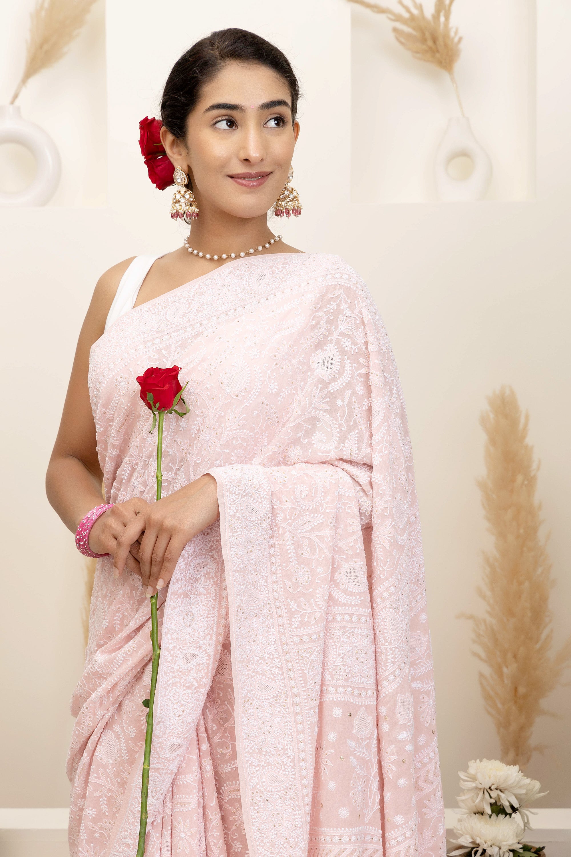 Elegant light pink pure silk georgette saree with fine embroidered Chikankari and mokaish work all over the saree