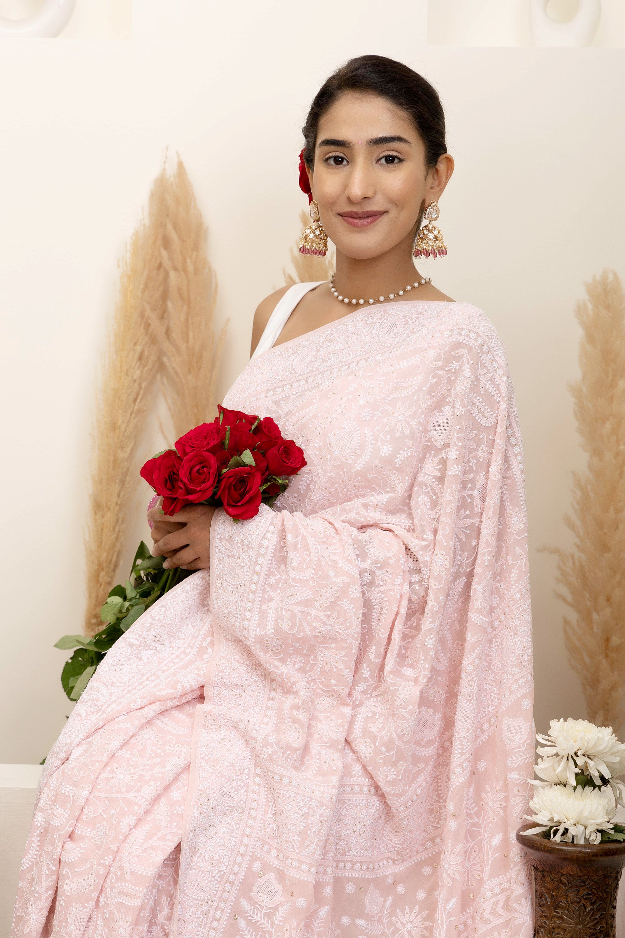 Elegant light pink pure silk georgette saree with fine embroidered Chikankari and mokaish work all over the saree