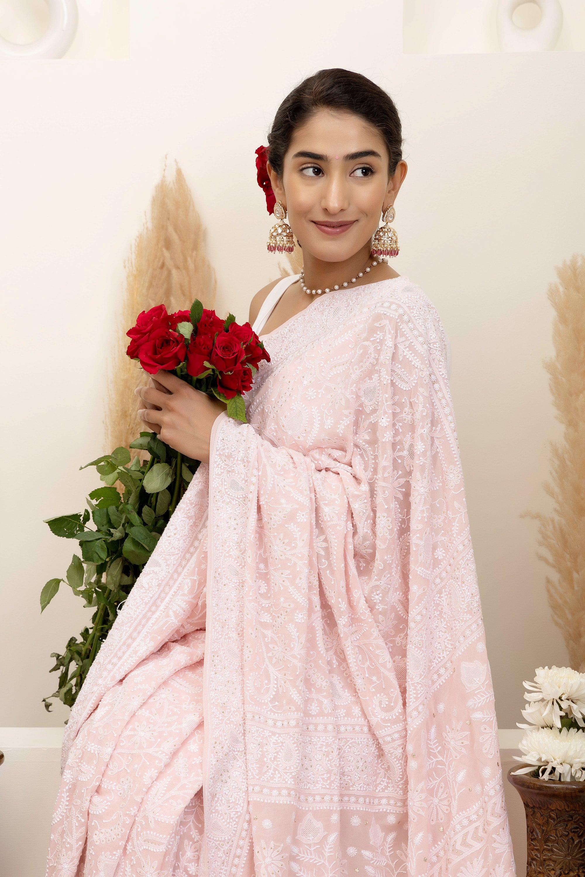 Elegant light pink pure silk georgette saree with fine embroidered Chikankari and mokaish work all over the saree