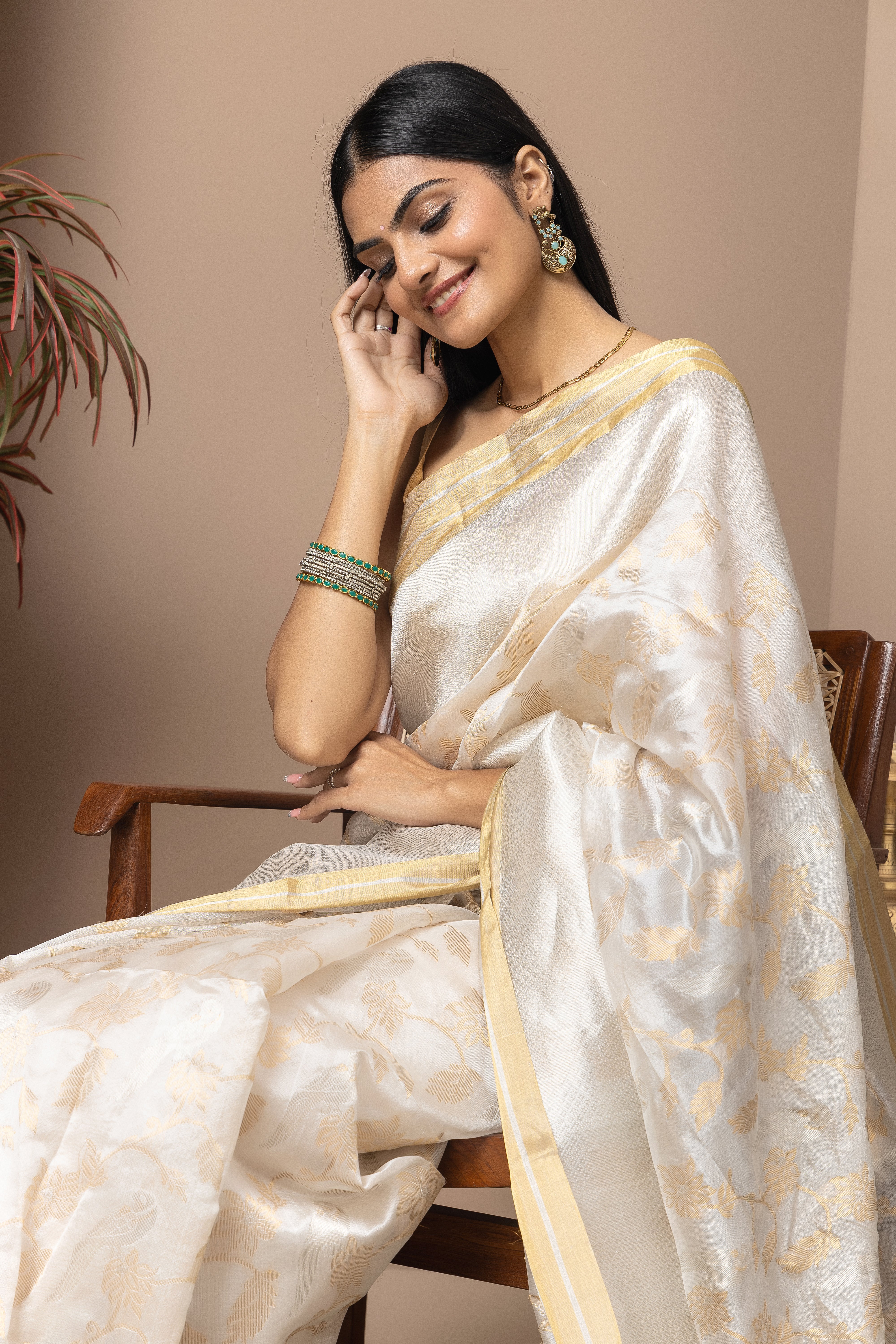 Chanderi handwoven pure pattu silk white saree with all-over golden and silver weaved design