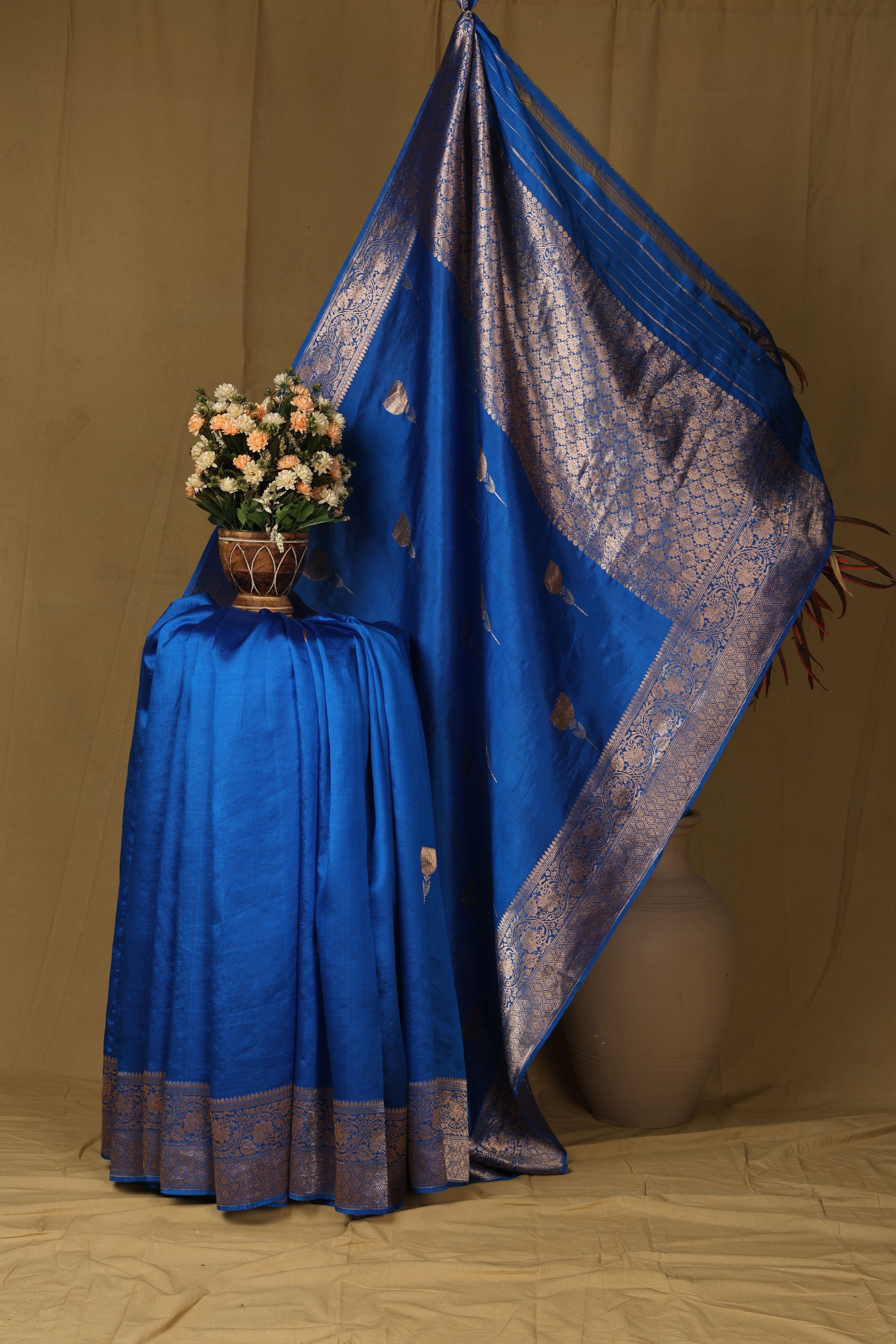 Banarasi pure silk blue handloom saree with intricate zari bute all over and intricate border