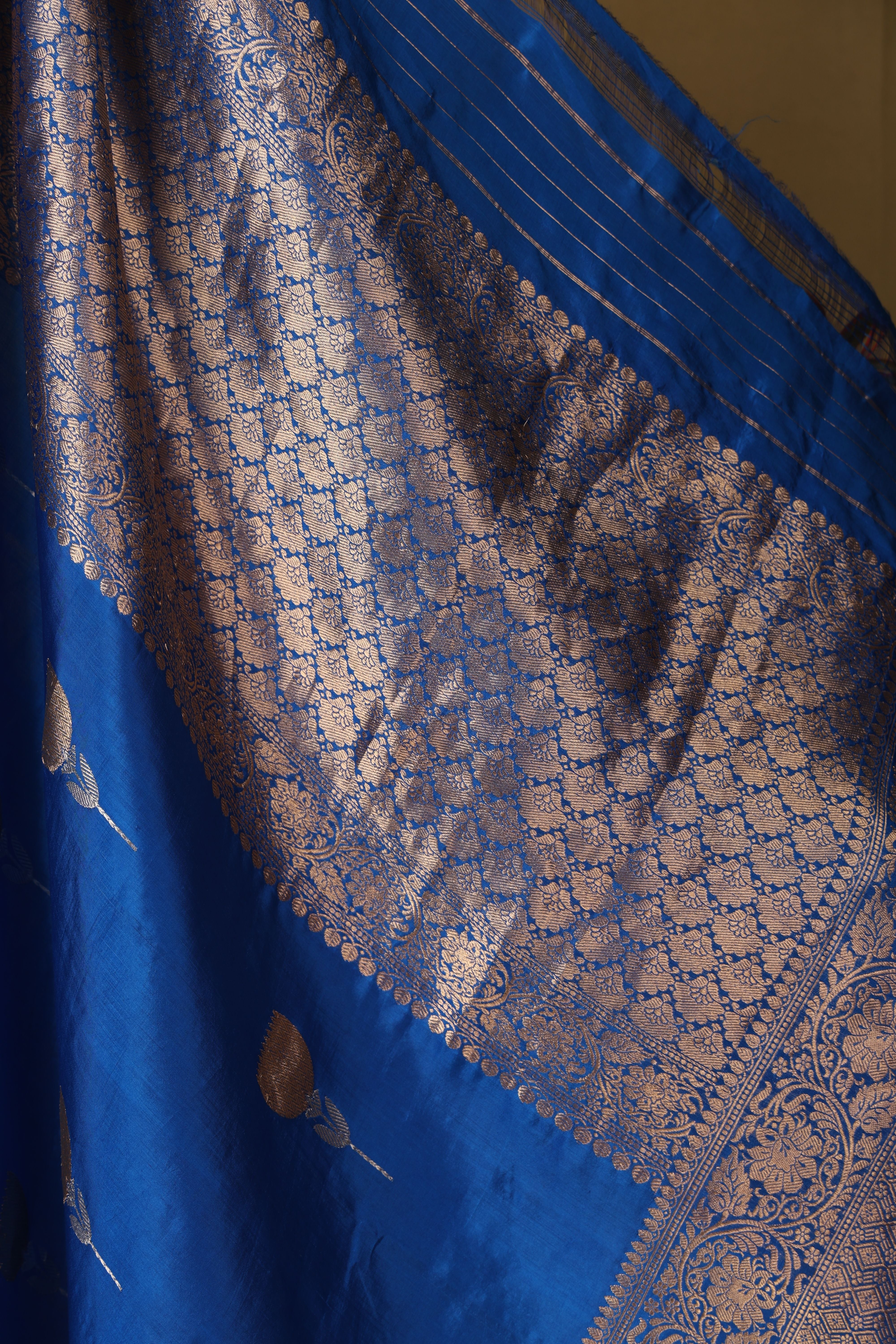Banarasi pure silk blue handloom saree with intricate zari bute all over and intricate border