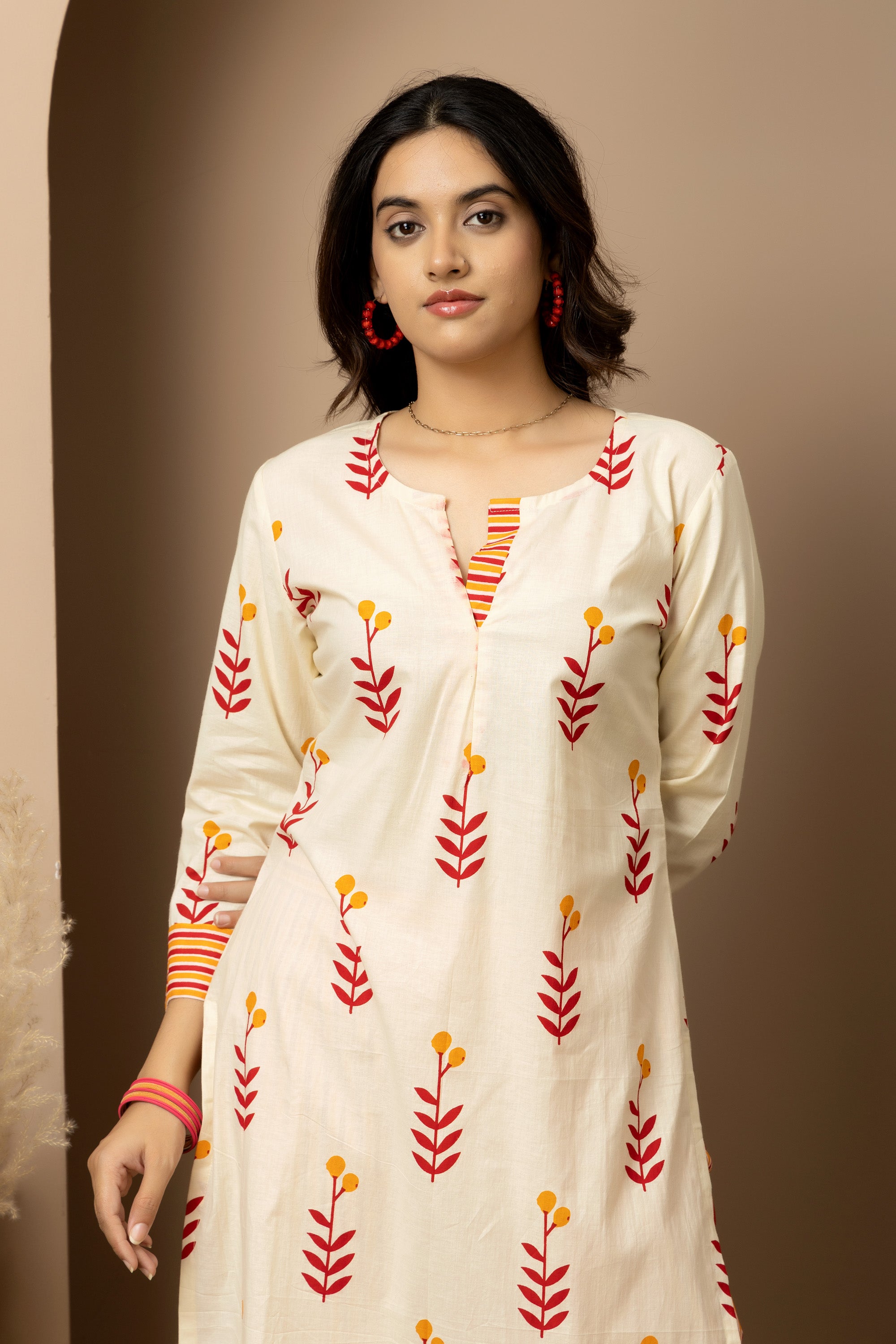 Kesar Bloom - Cotton kurta with pants in cream colour with orange-red floral screen print