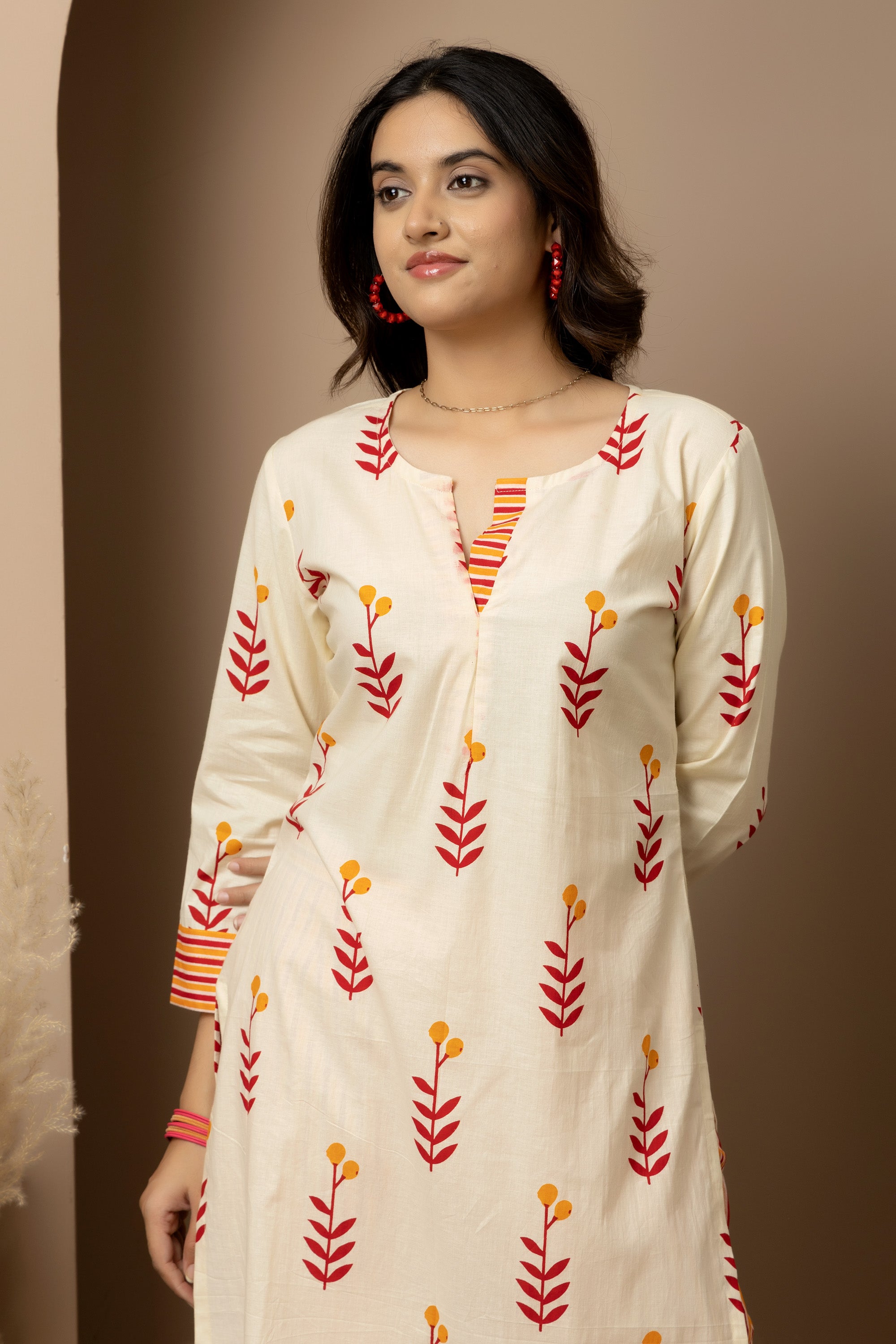 Kesar Bloom - Cotton kurta with pants in cream colour with orange-red floral screen print