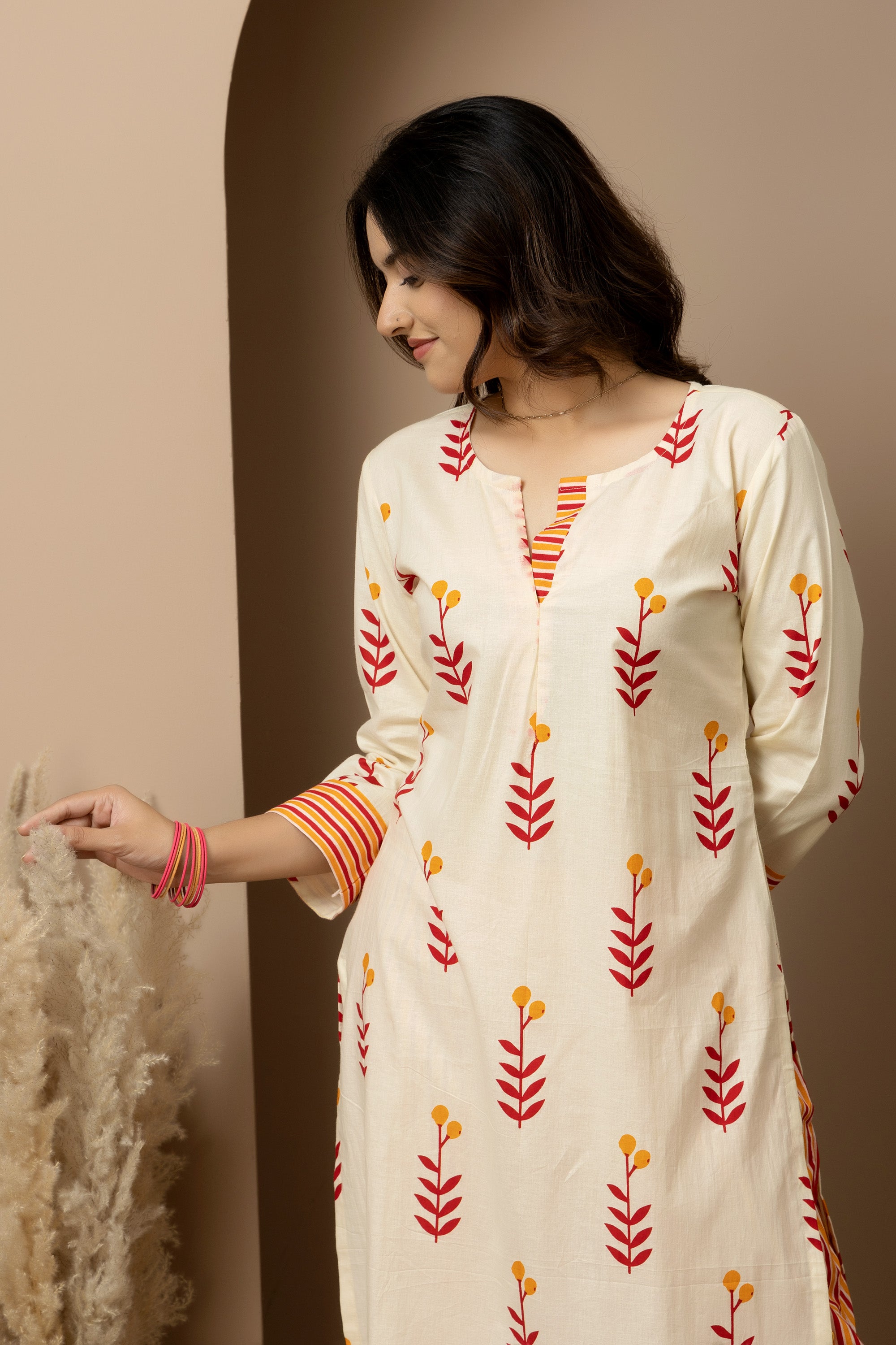 Kesar Bloom - Cotton kurta with pants in cream colour with orange-red floral screen print