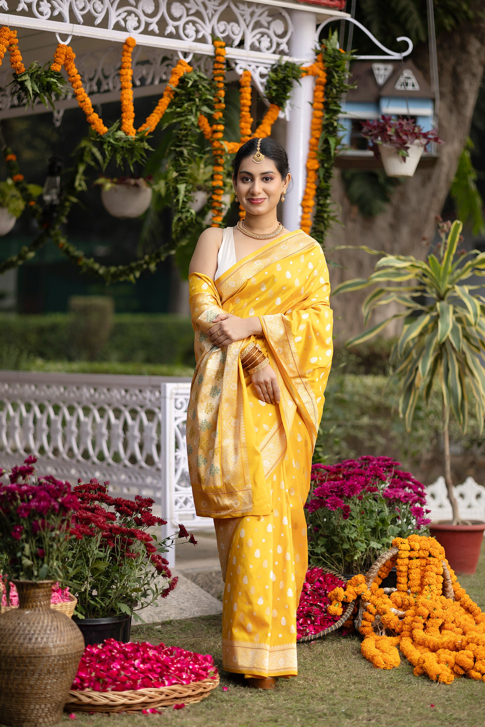 Banarasi pure silk yellow handloom saree with intricate zari Buti all over and intricate border with minakari work on the pallu