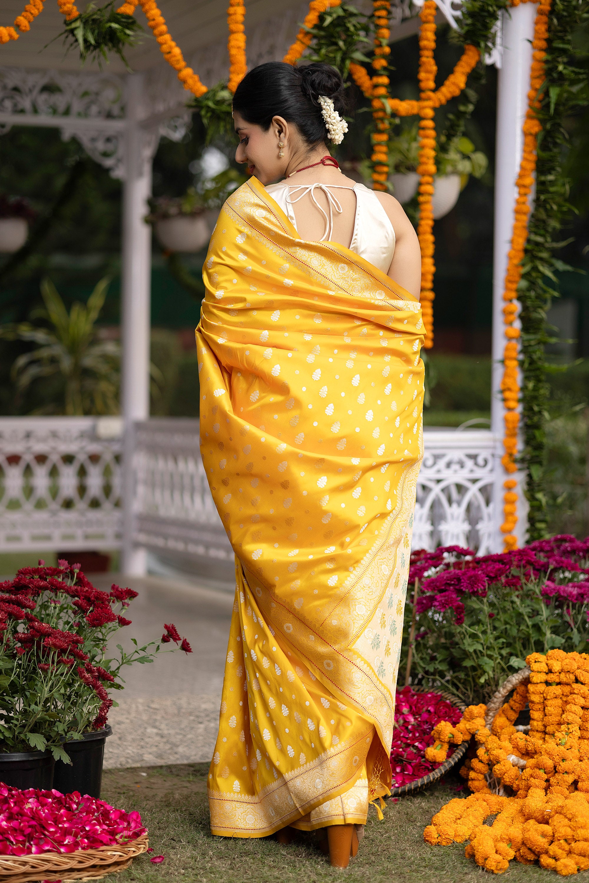Banarasi pure silk yellow handloom saree with intricate zari Buti all over and intricate border with minakari work on the pallu