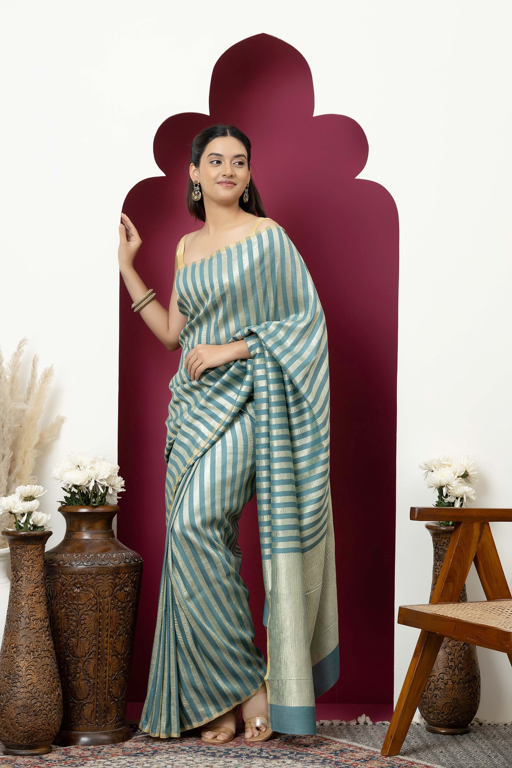 Beautiful Banarasi green pure Muga silk saree with alternate stripes of crinkled tissue and zari pallu