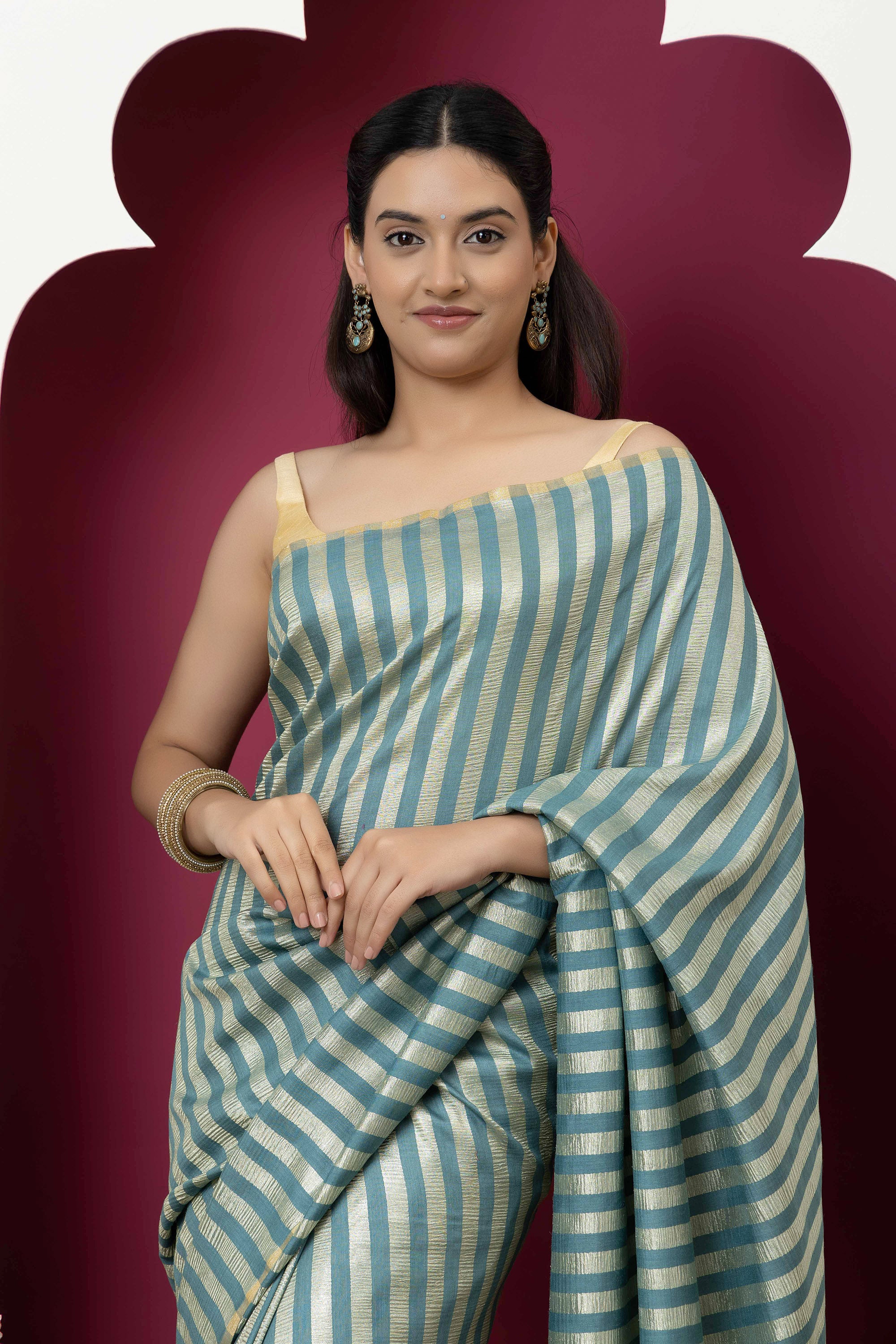 Beautiful Banarasi green pure Muga silk saree with alternate stripes of crinkled tissue and zari pallu