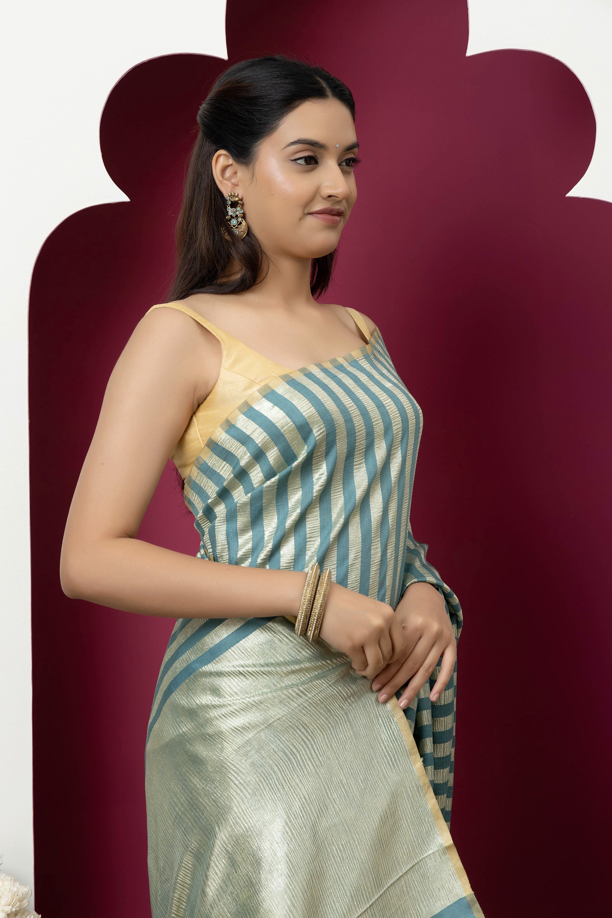 Beautiful Banarasi green pure Muga silk saree with alternate stripes of crinkled tissue and zari pallu