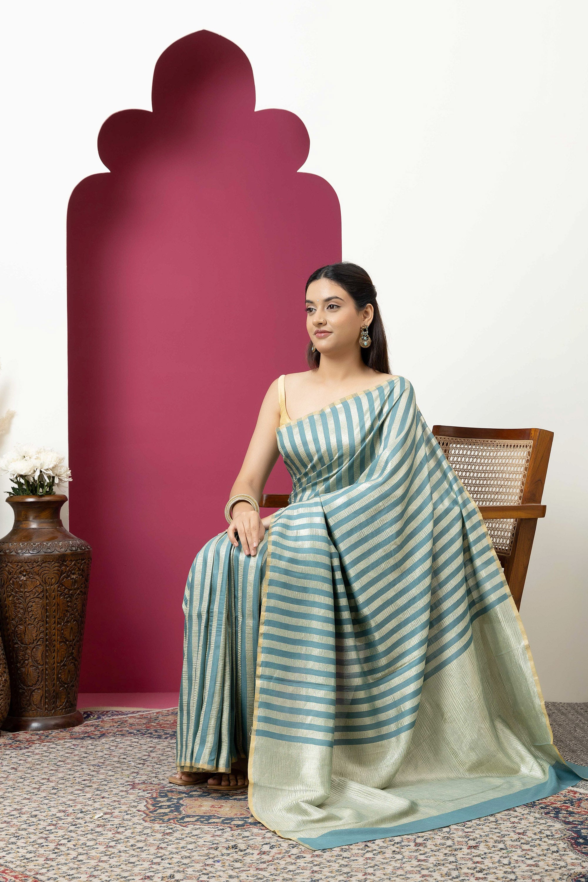 Beautiful Banarasi green pure Muga silk saree with alternate stripes of crinkled tissue and zari pallu
