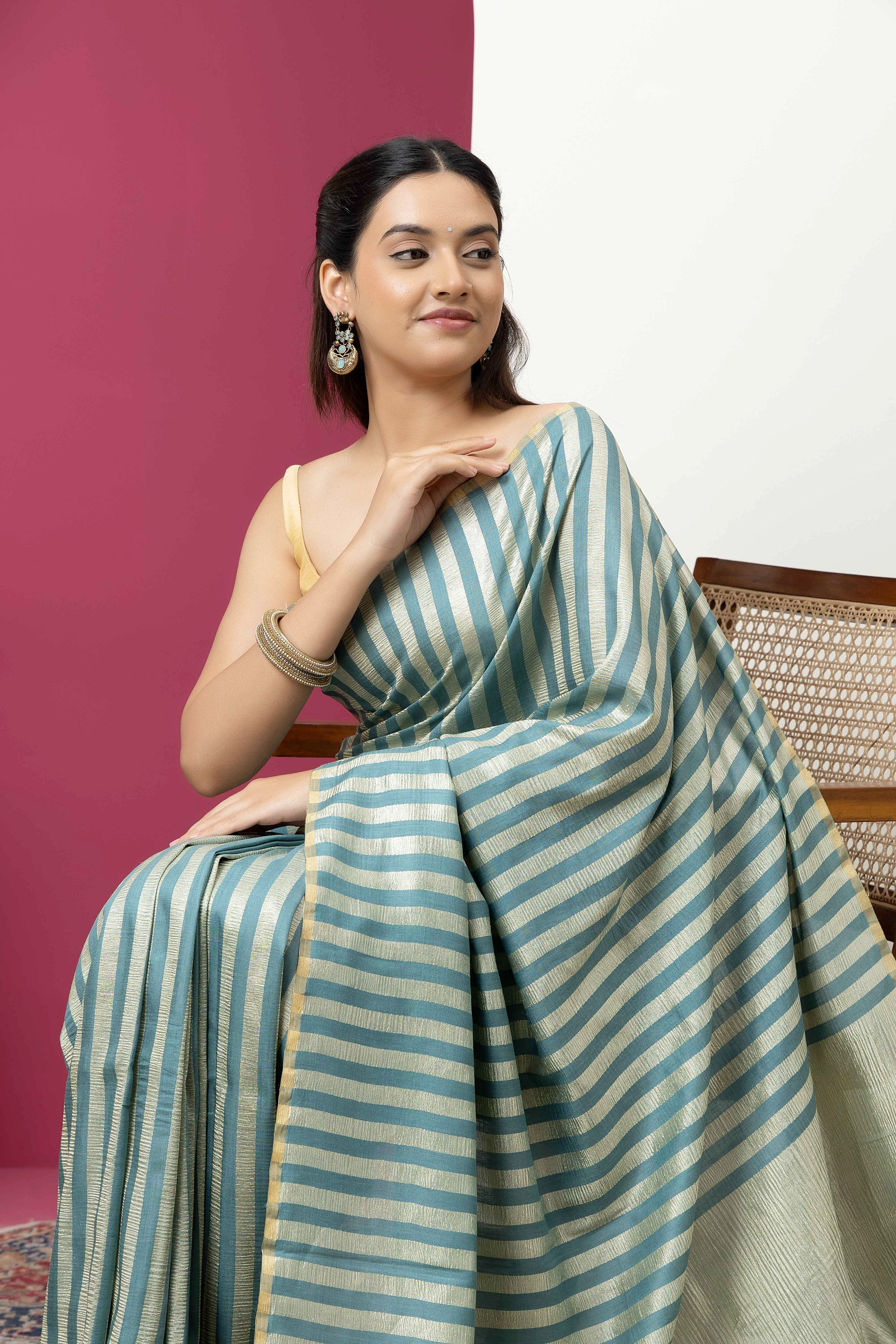 Beautiful Banarasi green pure Muga silk saree with alternate stripes of crinkled tissue and zari pallu
