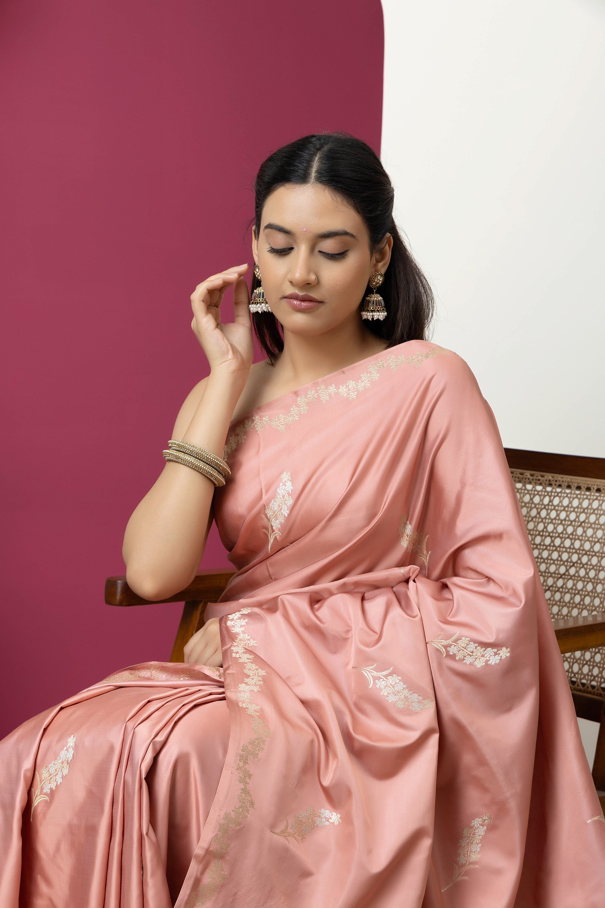 Banarasi Handloom rosewood pink pure Mashru Katan silk  saree with running vine adorned with flowers on the border, small bute all over and zari border