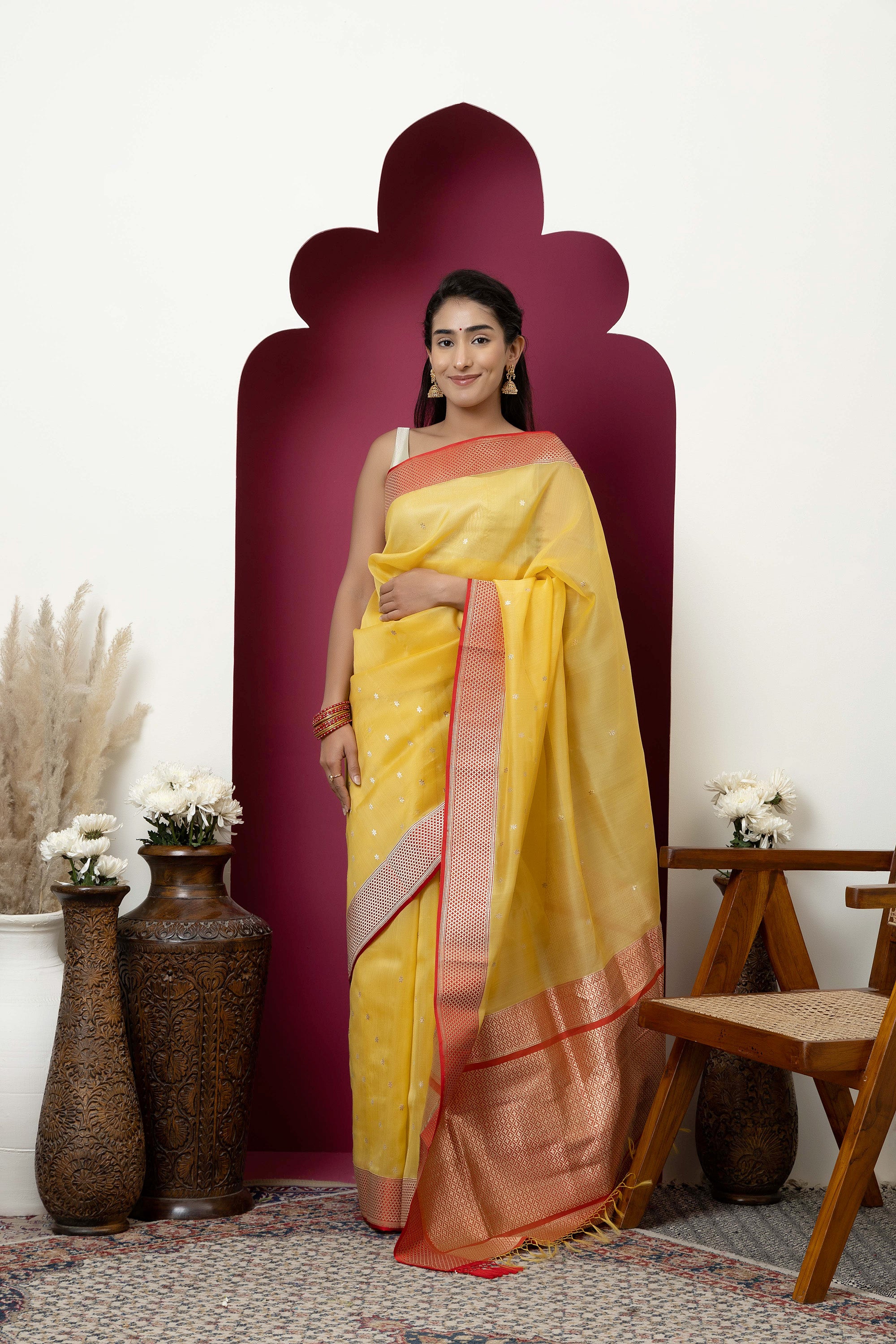 Banarasi handloom pure organza silk saree in summerish yellow shade with zari border and pallu on a red/crimson contrast silk