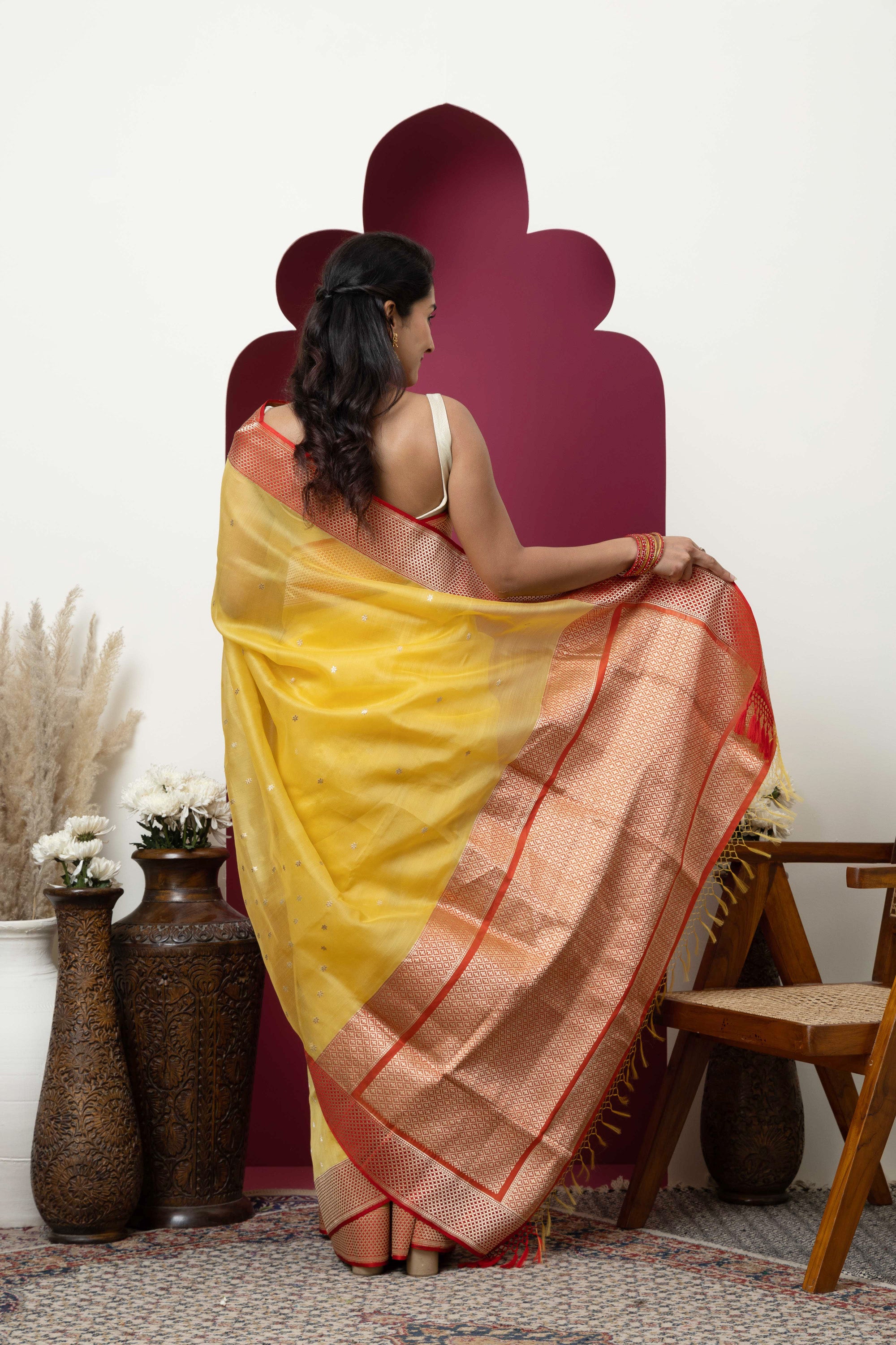 Banarasi handloom pure organza silk saree in summerish yellow shade with zari border and pallu on a red/crimson contrast silk