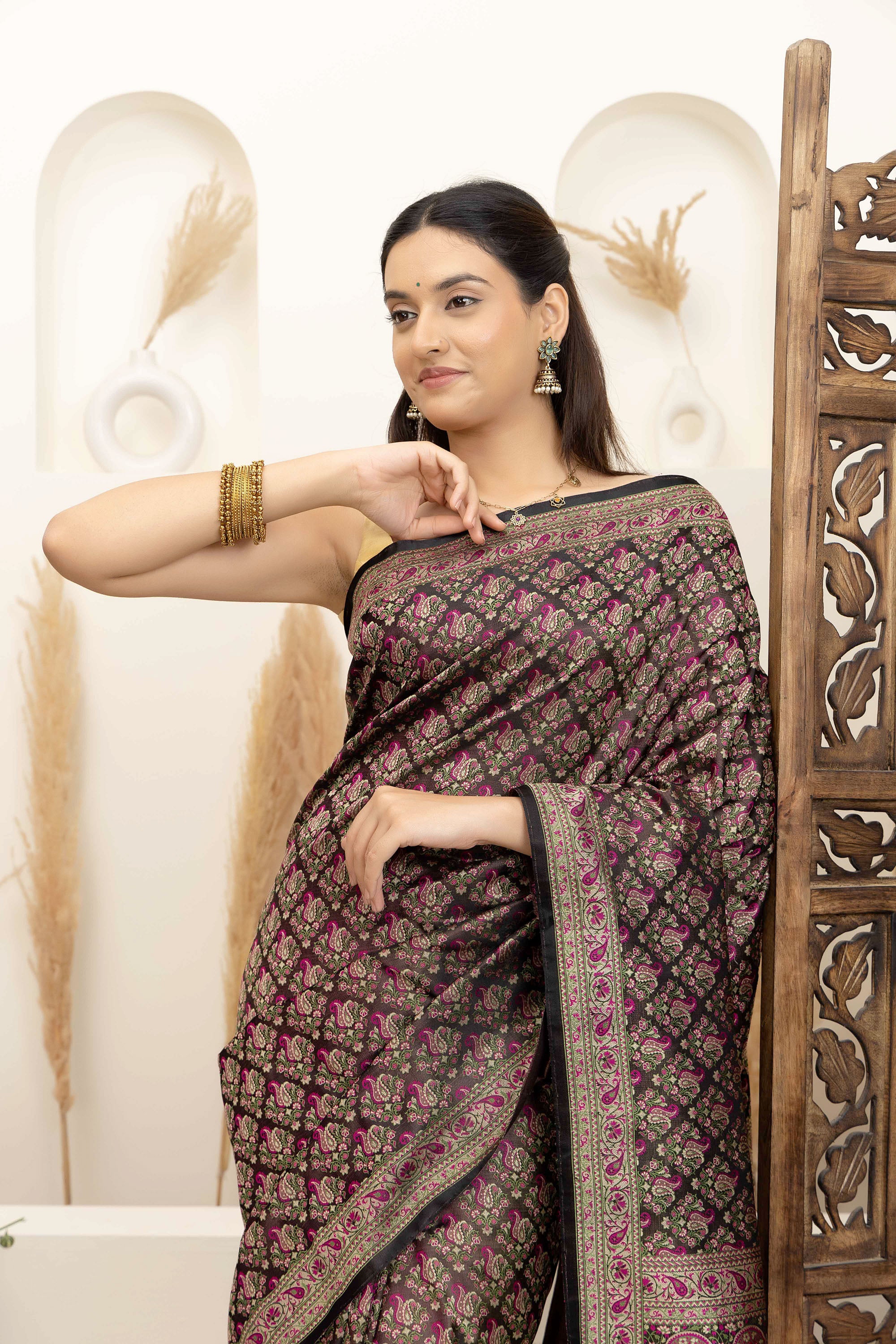 Banarasi pure silk tanchui saree. It’s a rich majenta on brown undertone saree with intricate resham weaving