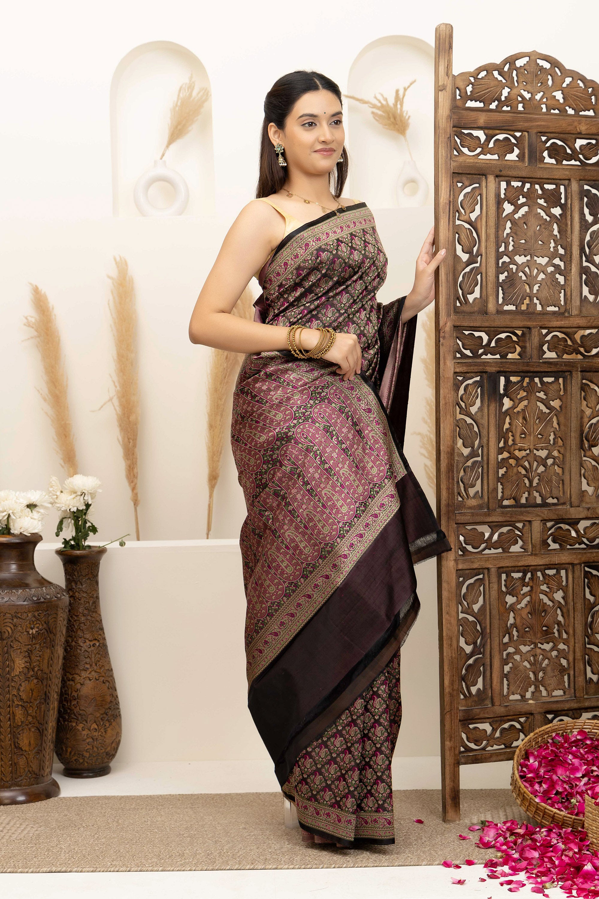 Banarasi pure silk tanchui saree. It’s a rich majenta on brown undertone saree with intricate resham weaving