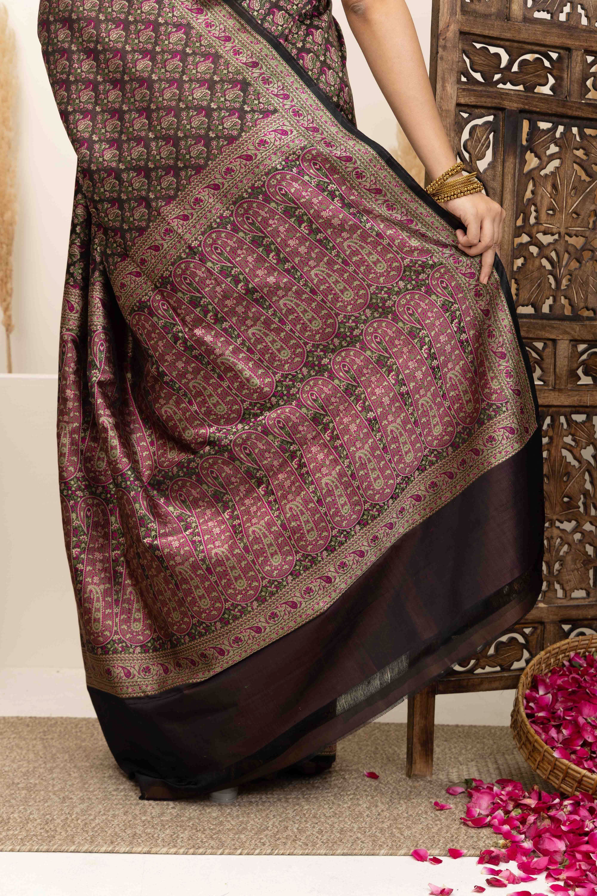 Banarasi pure silk tanchui saree. It’s a rich majenta on brown undertone saree with intricate resham weaving