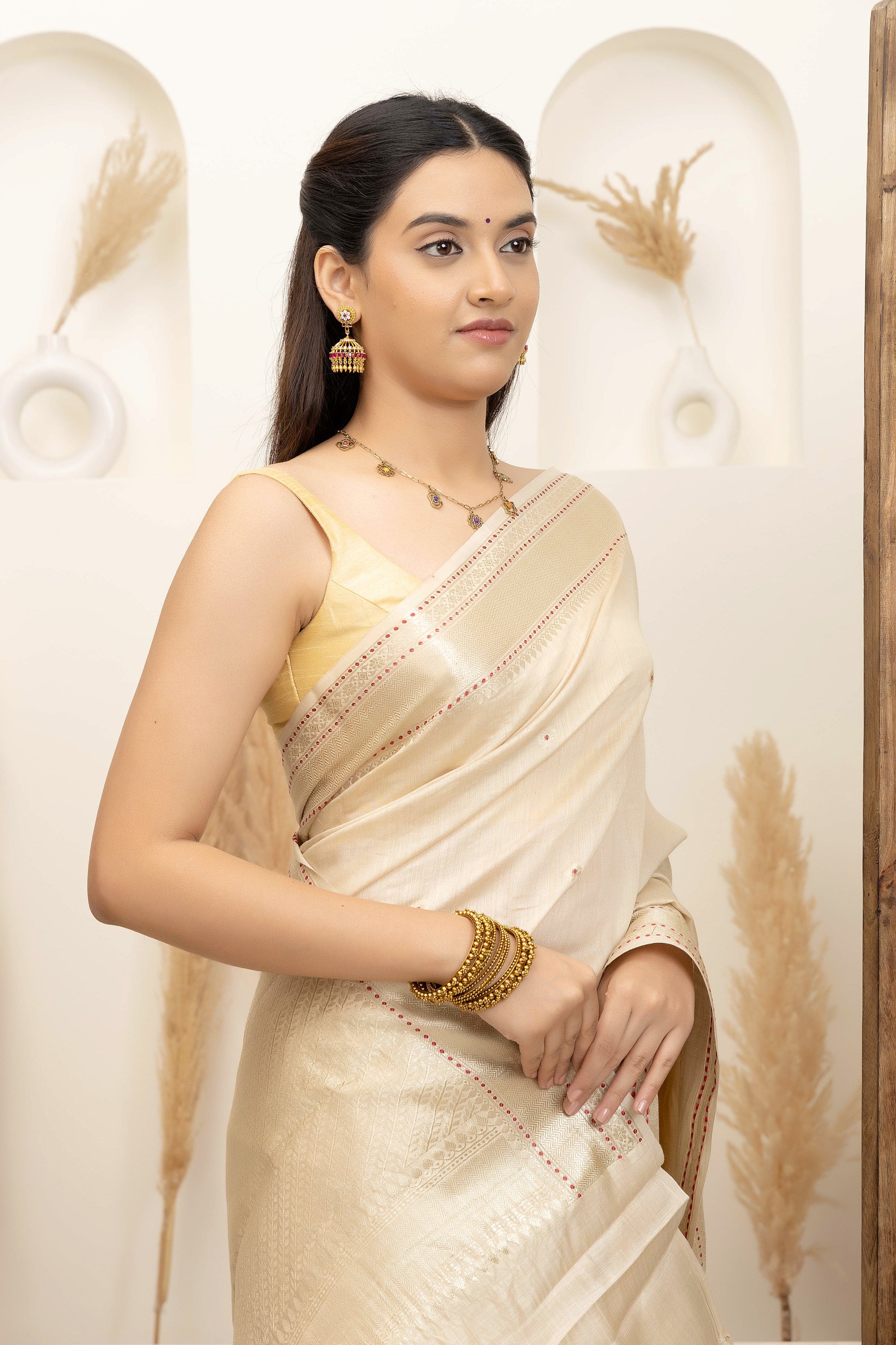 Banarasi Pure muga silk saree in natural silk beige colour, with small bute, zari border and pallu
