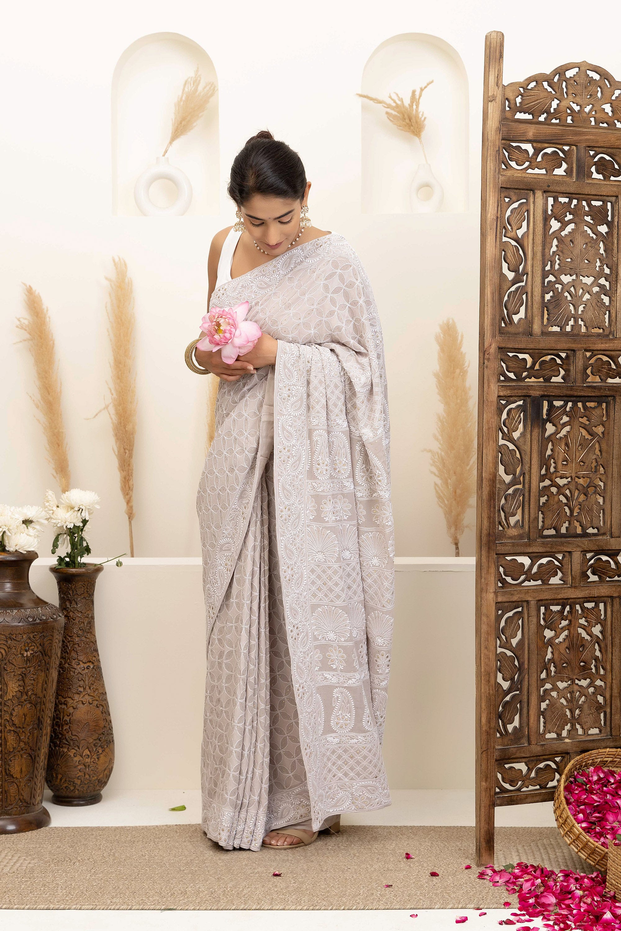 Elegant grey pure heavy georgette silk saree with fine embroidered Chikankari work all over the saree