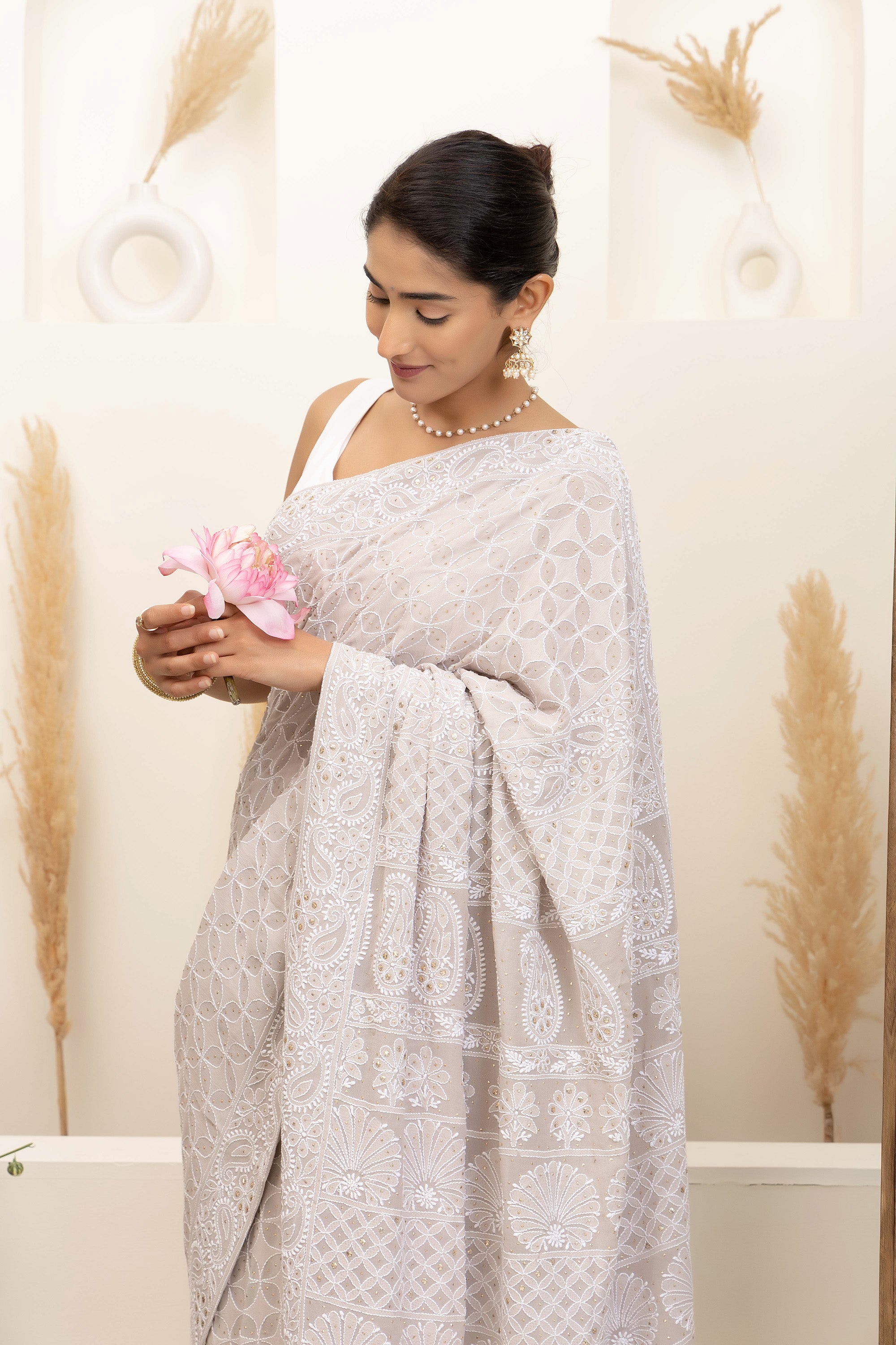 Elegant grey pure heavy georgette silk saree with fine embroidered Chikankari work all over the saree