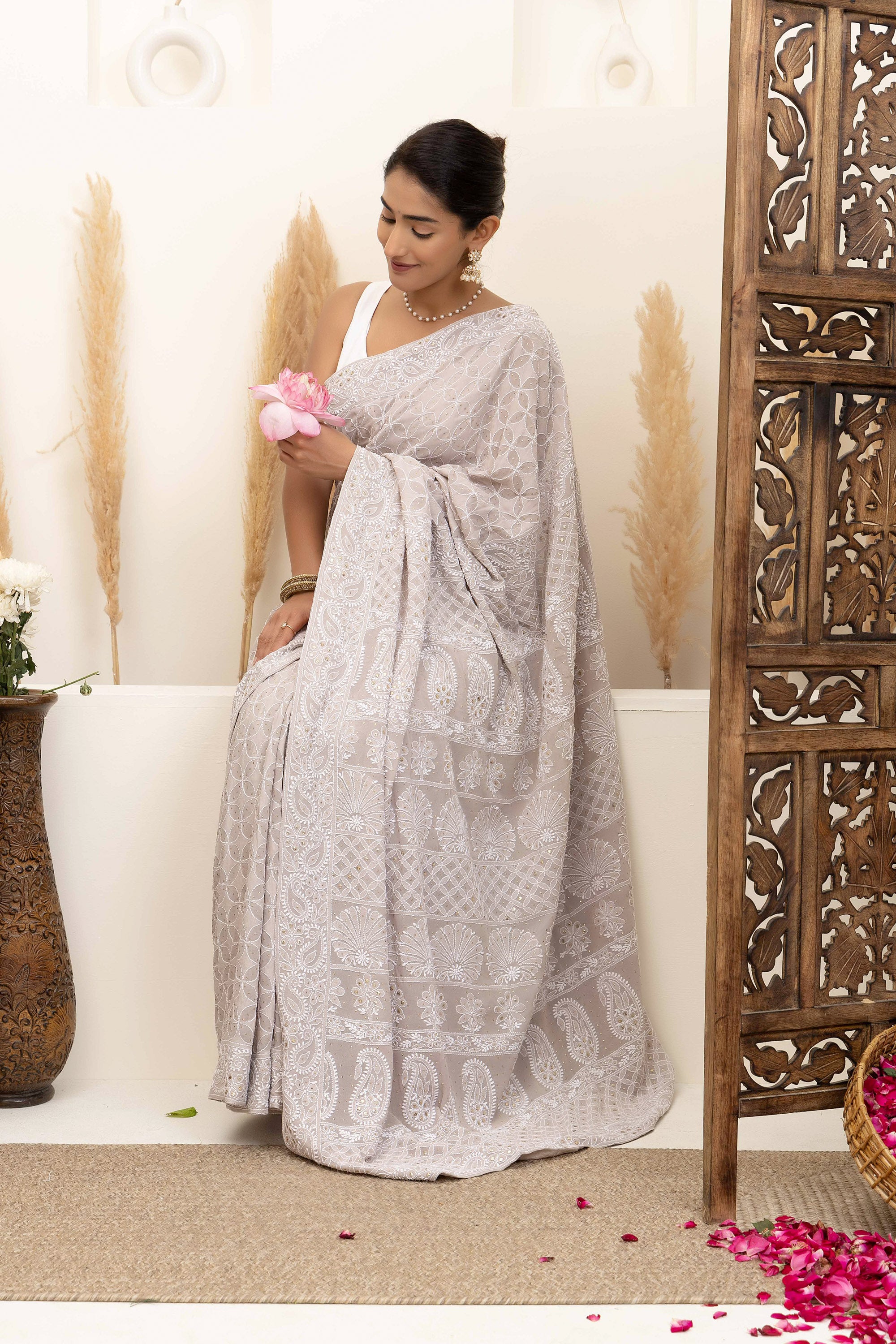 Elegant grey pure heavy georgette silk saree with fine embroidered Chikankari work all over the saree