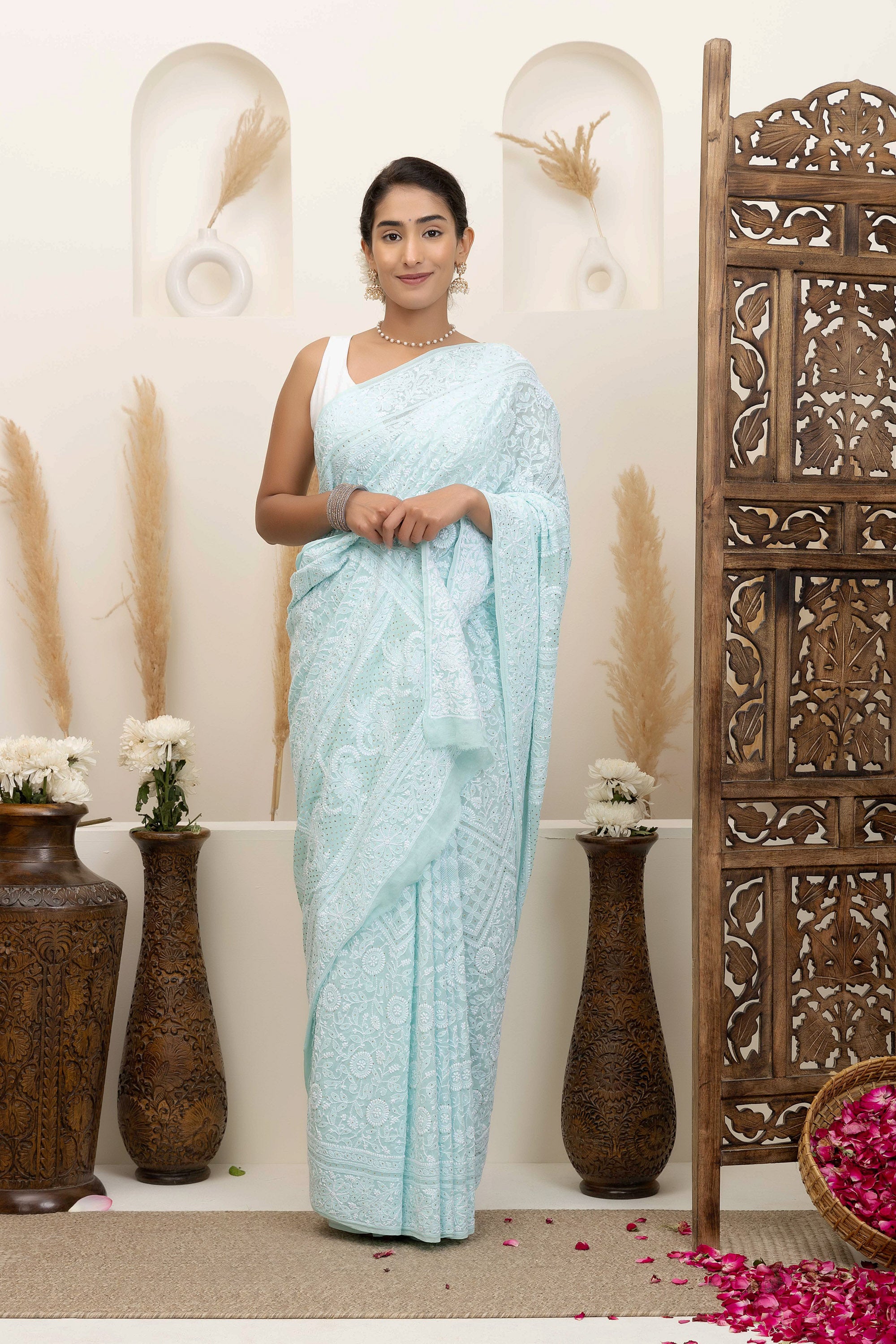 Elegant light blue pure silk georgette saree with fine embroidered Chikankari and mokaish work all over the saree