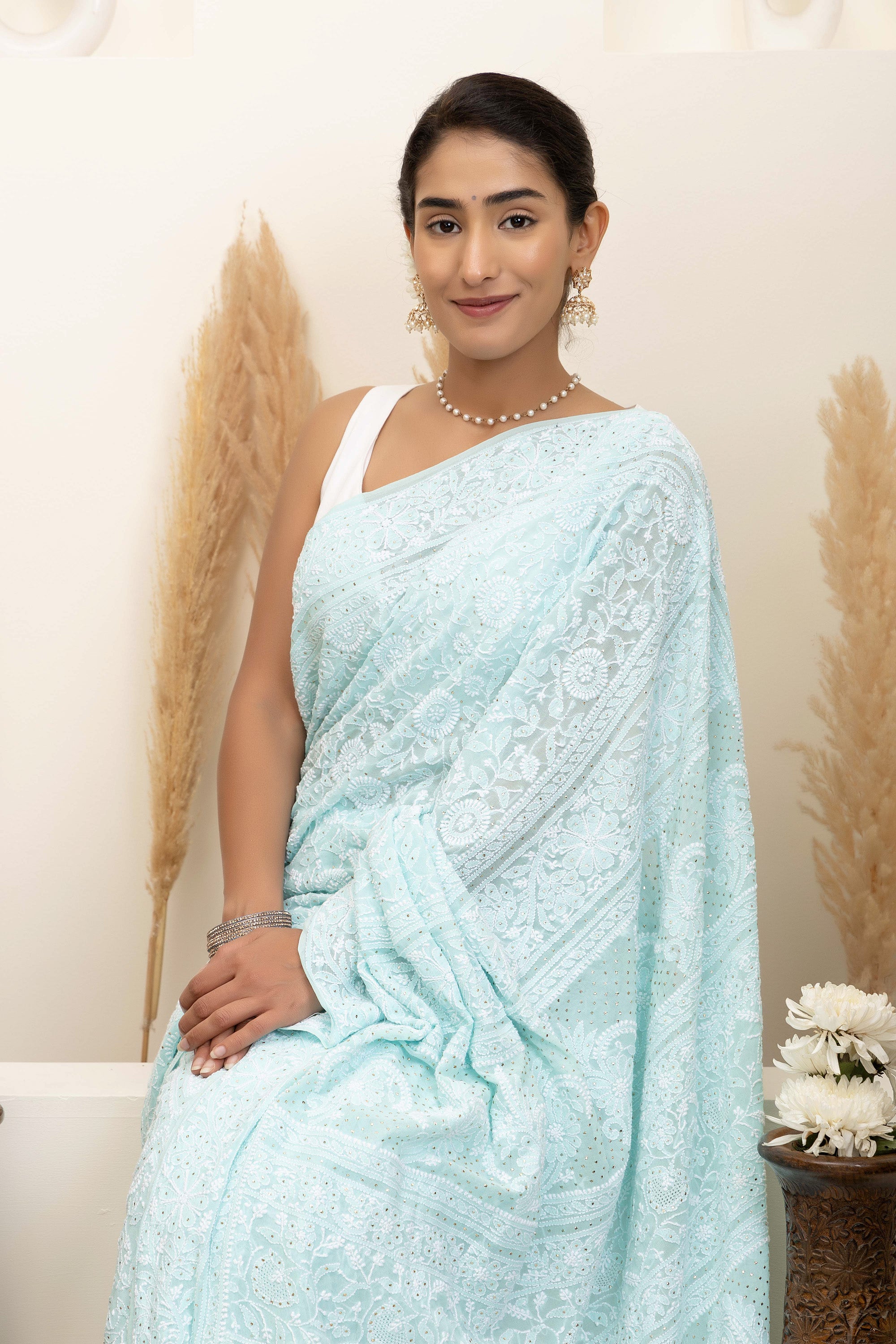 Elegant light blue pure silk georgette saree with fine embroidered Chikankari and mokaish work all over the saree