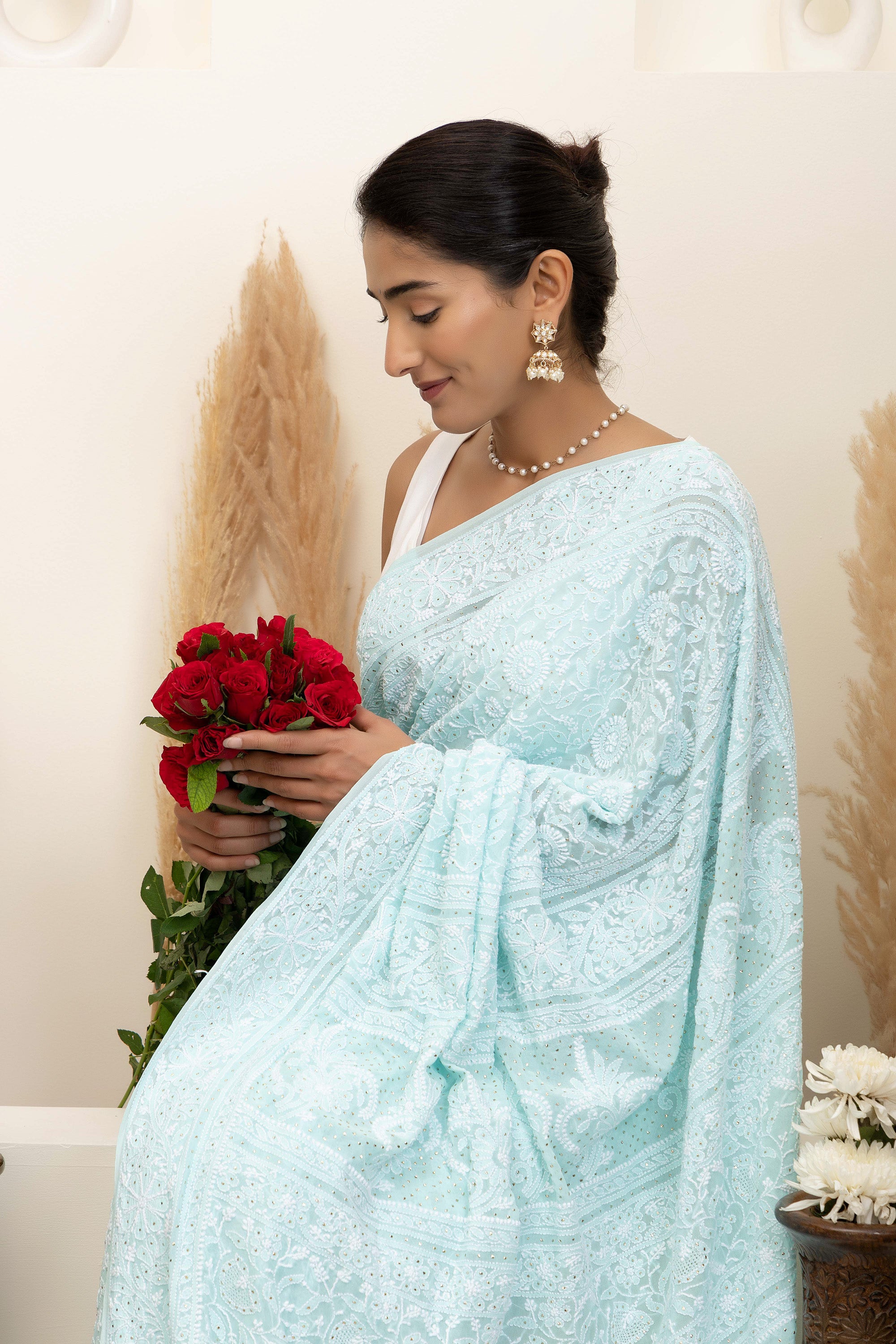 Elegant light blue pure silk georgette saree with fine embroidered Chikankari and mokaish work all over the saree