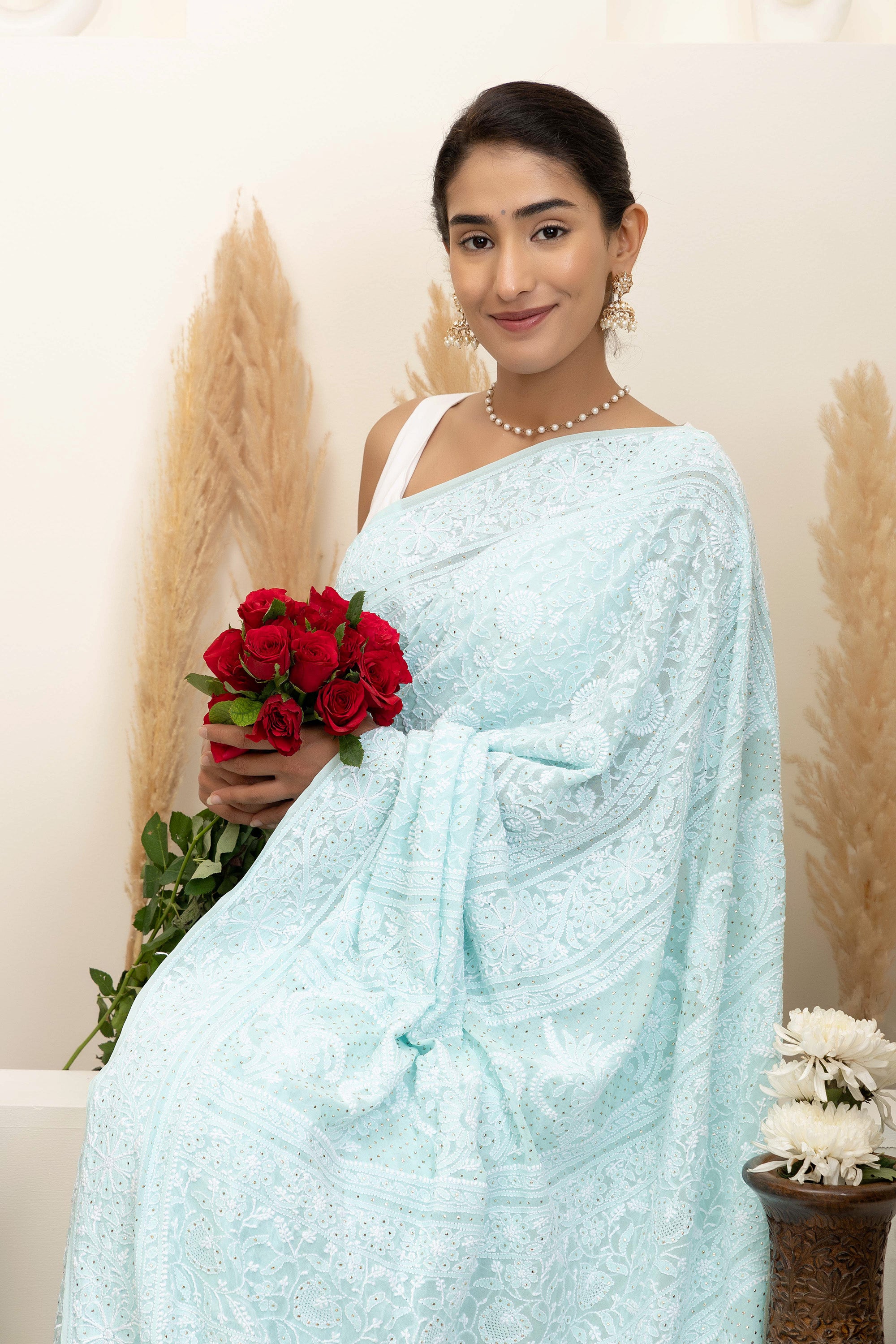 Elegant light blue pure silk georgette saree with fine embroidered Chikankari and mokaish work all over the saree