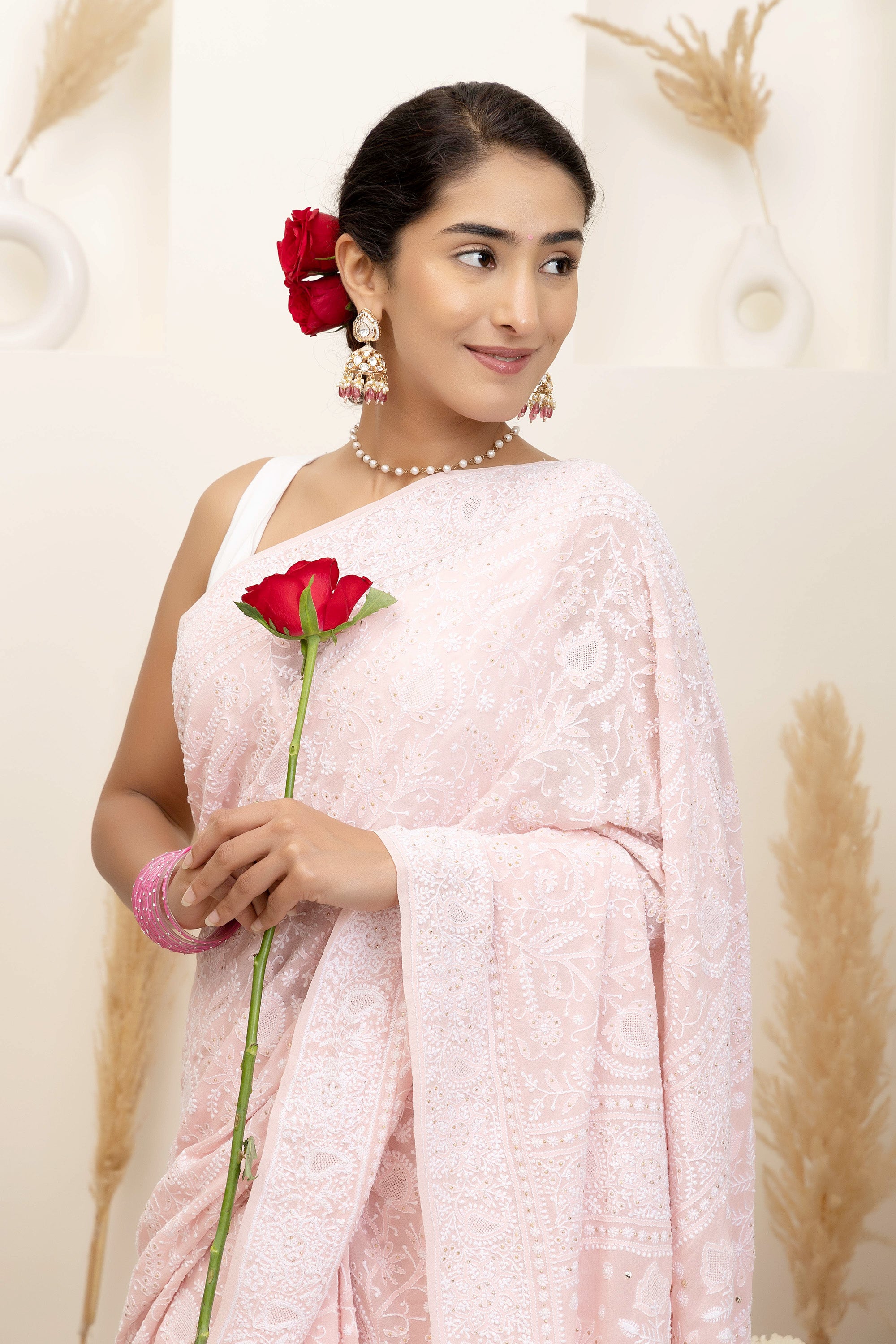 Elegant light pink pure silk georgette saree with fine embroidered Chikankari and mokaish work all over the saree