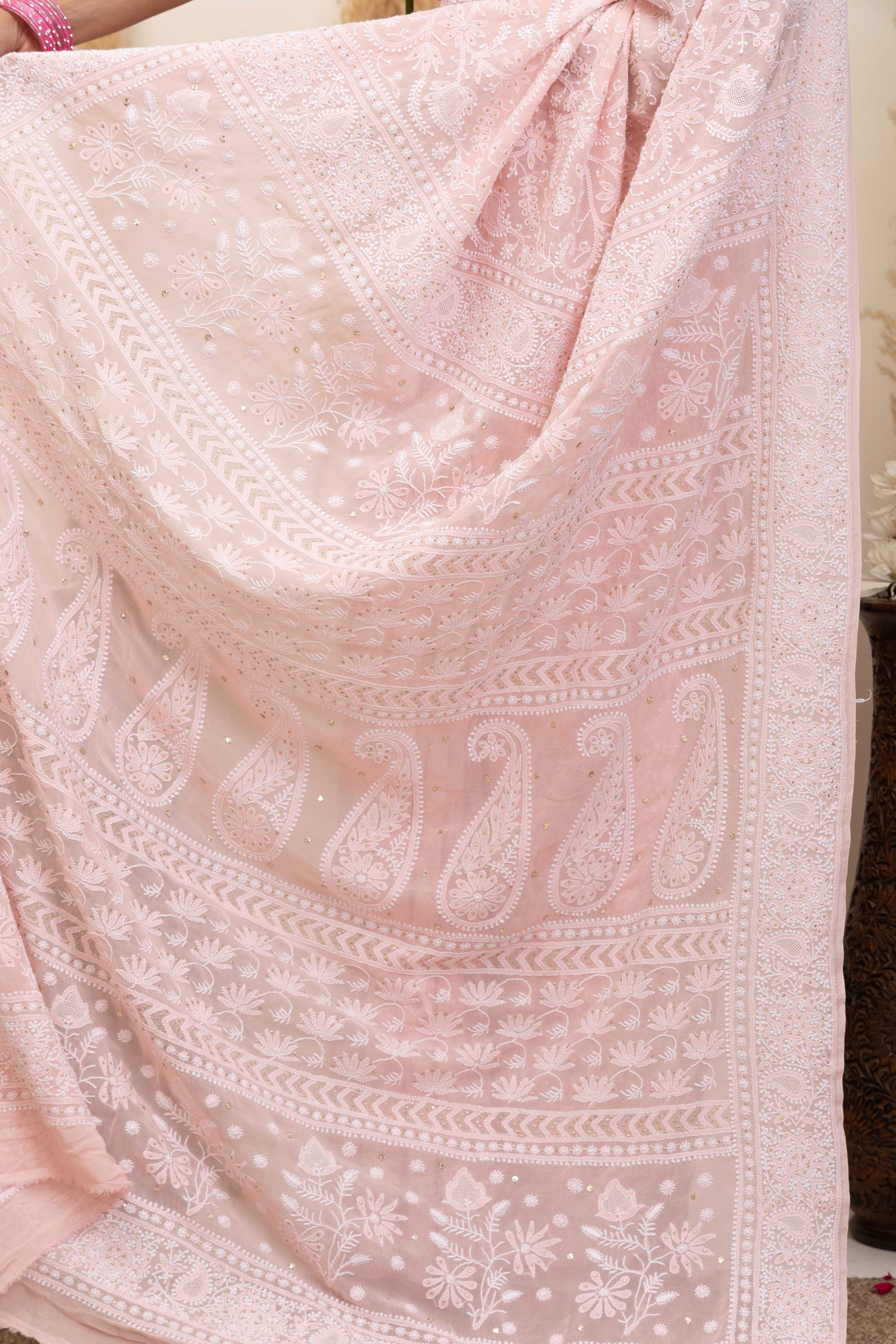 Elegant light pink pure silk georgette saree with fine embroidered Chikankari and mokaish work all over the saree