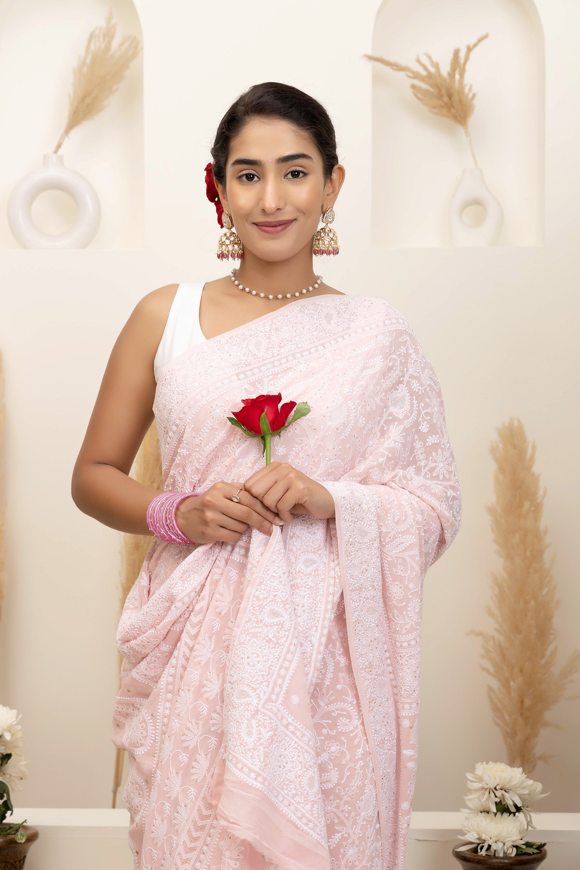 Elegant light pink pure silk georgette saree with fine embroidered Chikankari and mokaish work all over the saree