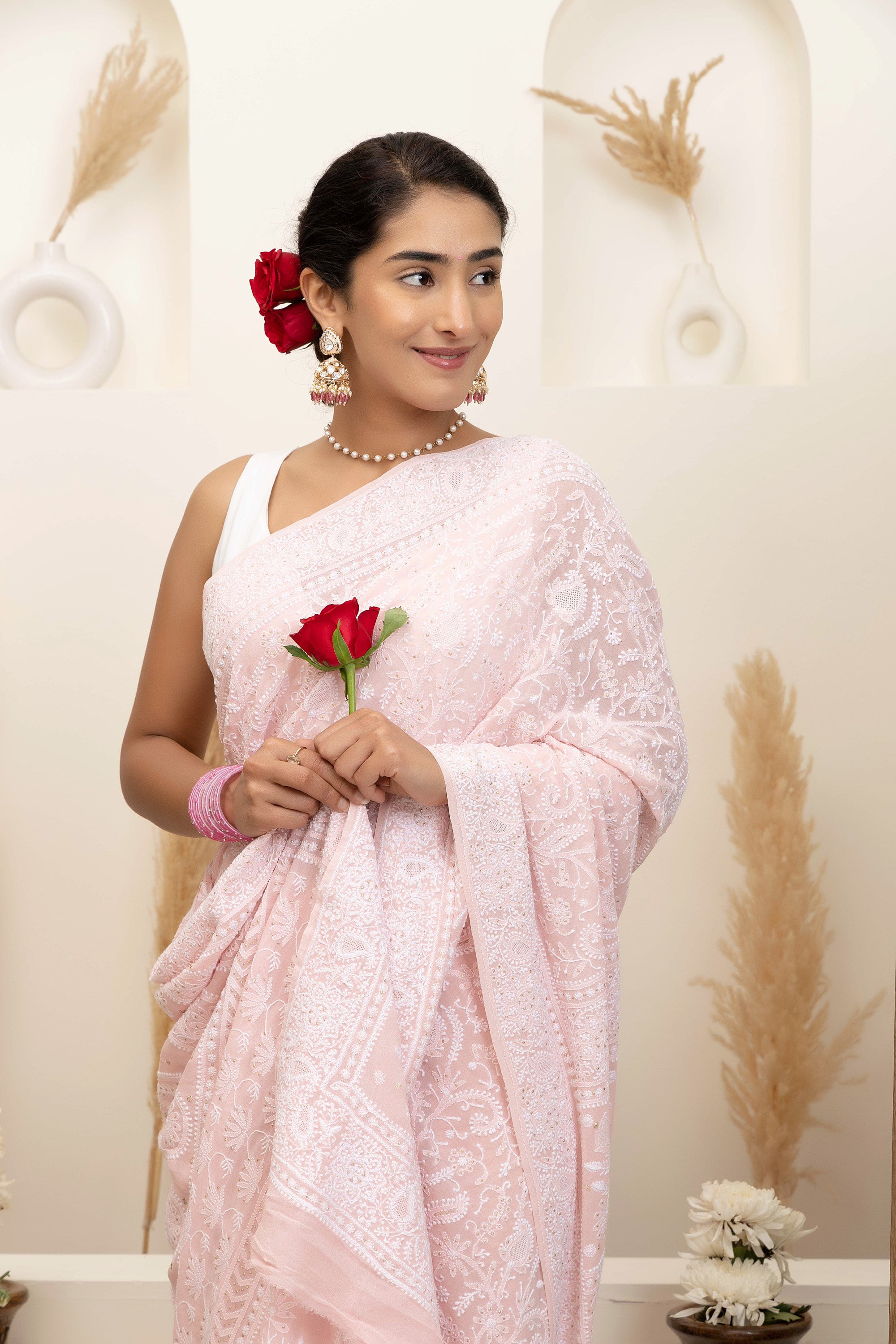 Elegant light pink pure silk georgette saree with fine embroidered Chikankari and mokaish work all over the saree