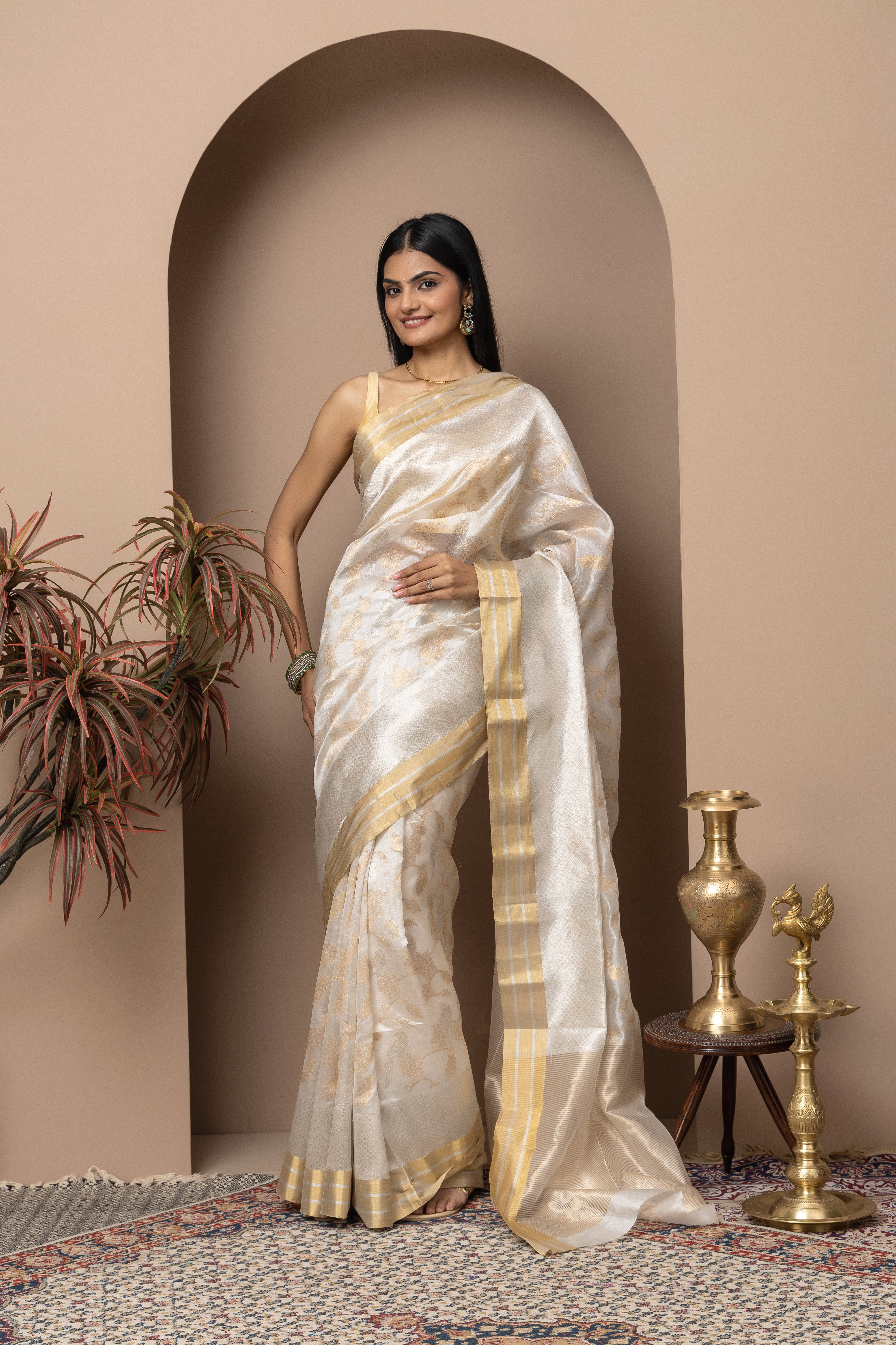 Chanderi handwoven pure pattu silk white saree with all-over golden and silver weaved design