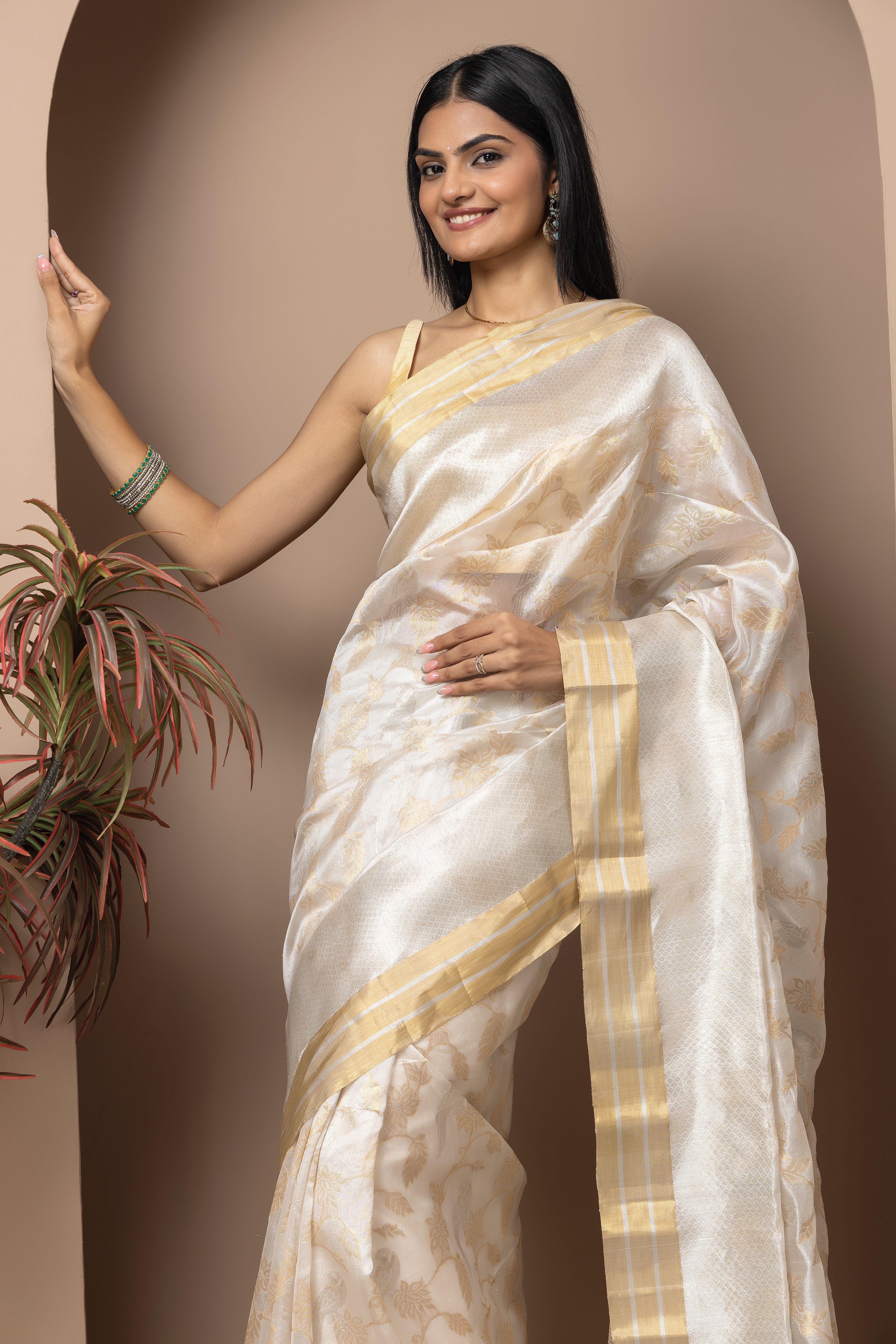 Chanderi handwoven pure pattu silk white saree with all-over golden and silver weaved design